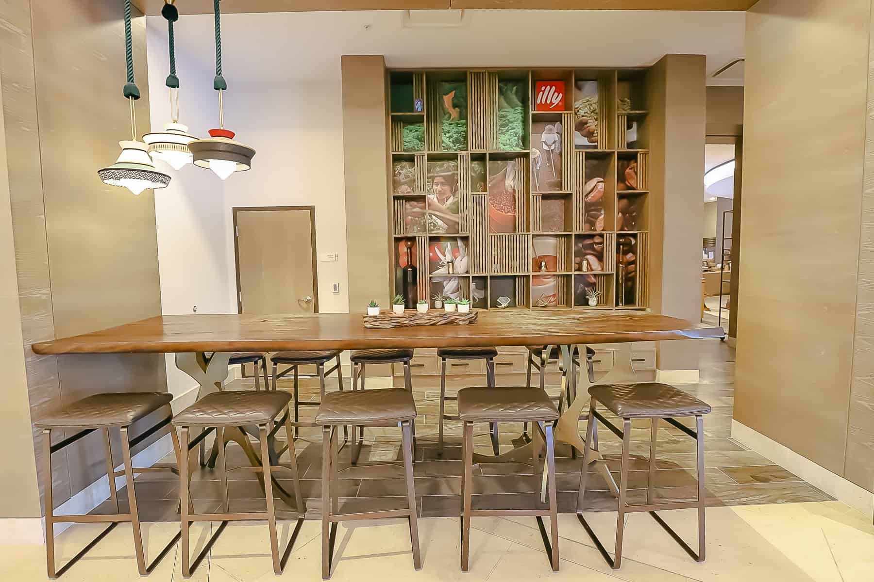 work area with counter height table and counter height chairs in the hotel lobby