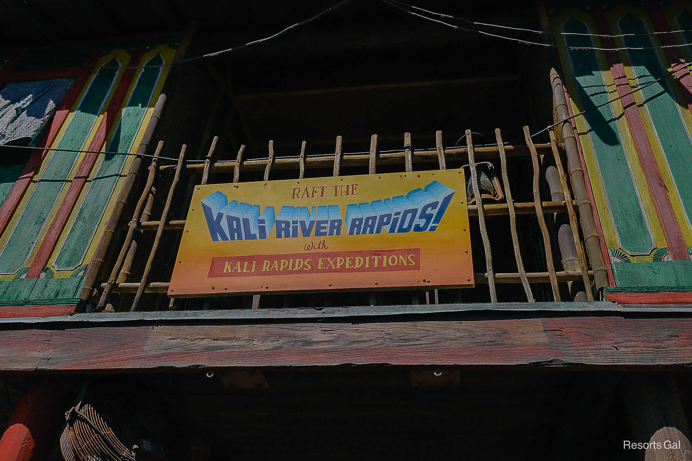 the attraction sign reads "Raft the Kali River Rapids with Kali Rapids Expeditions"