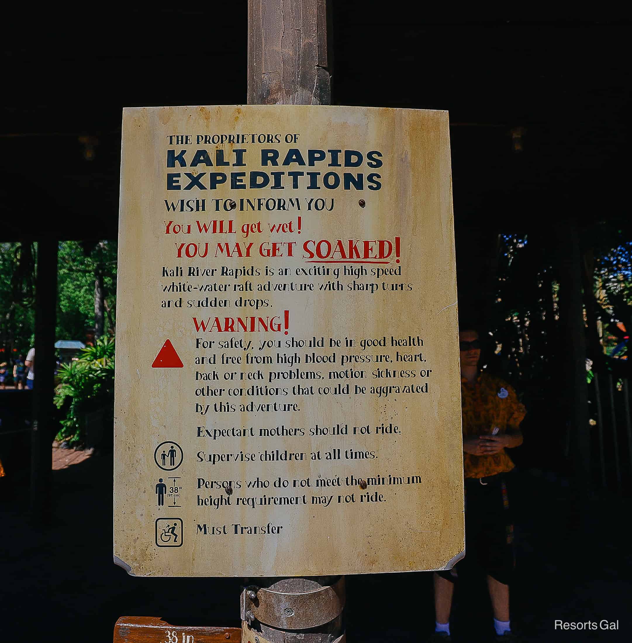a sign with warnings for experiencing Kali River Rapids 