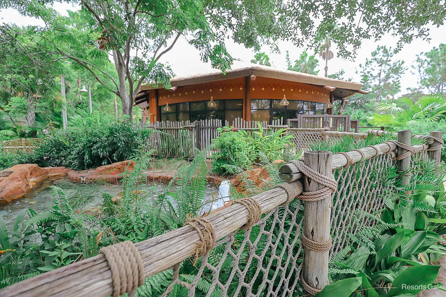 a fence with landscaping around it surrounds the top of Samawati Springs 