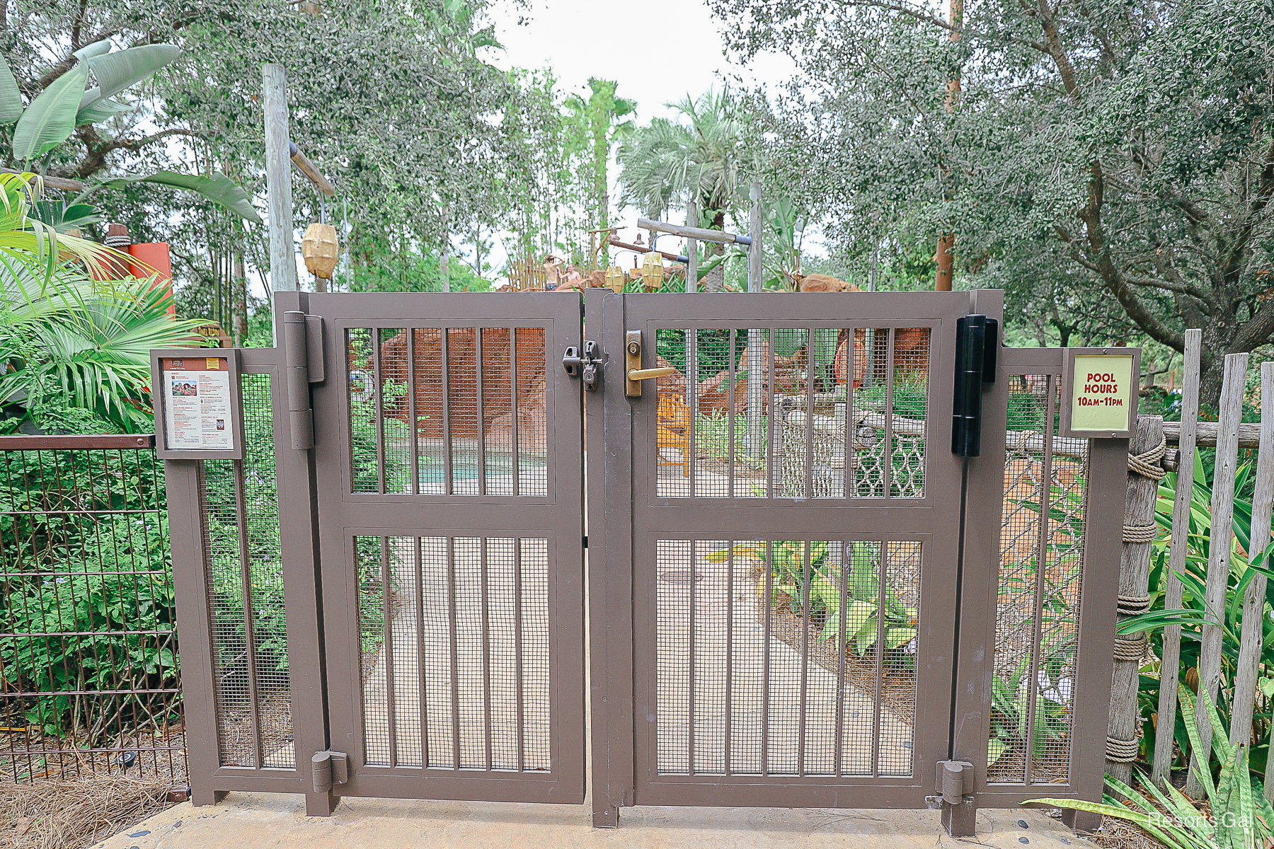 pool gates with posted pool hours 
