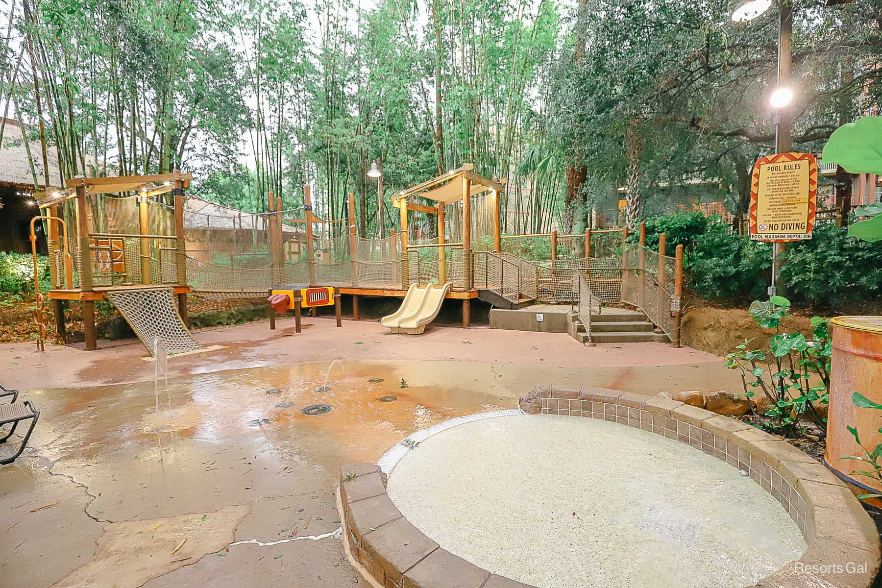 a small kiddie pool with a dry playground 