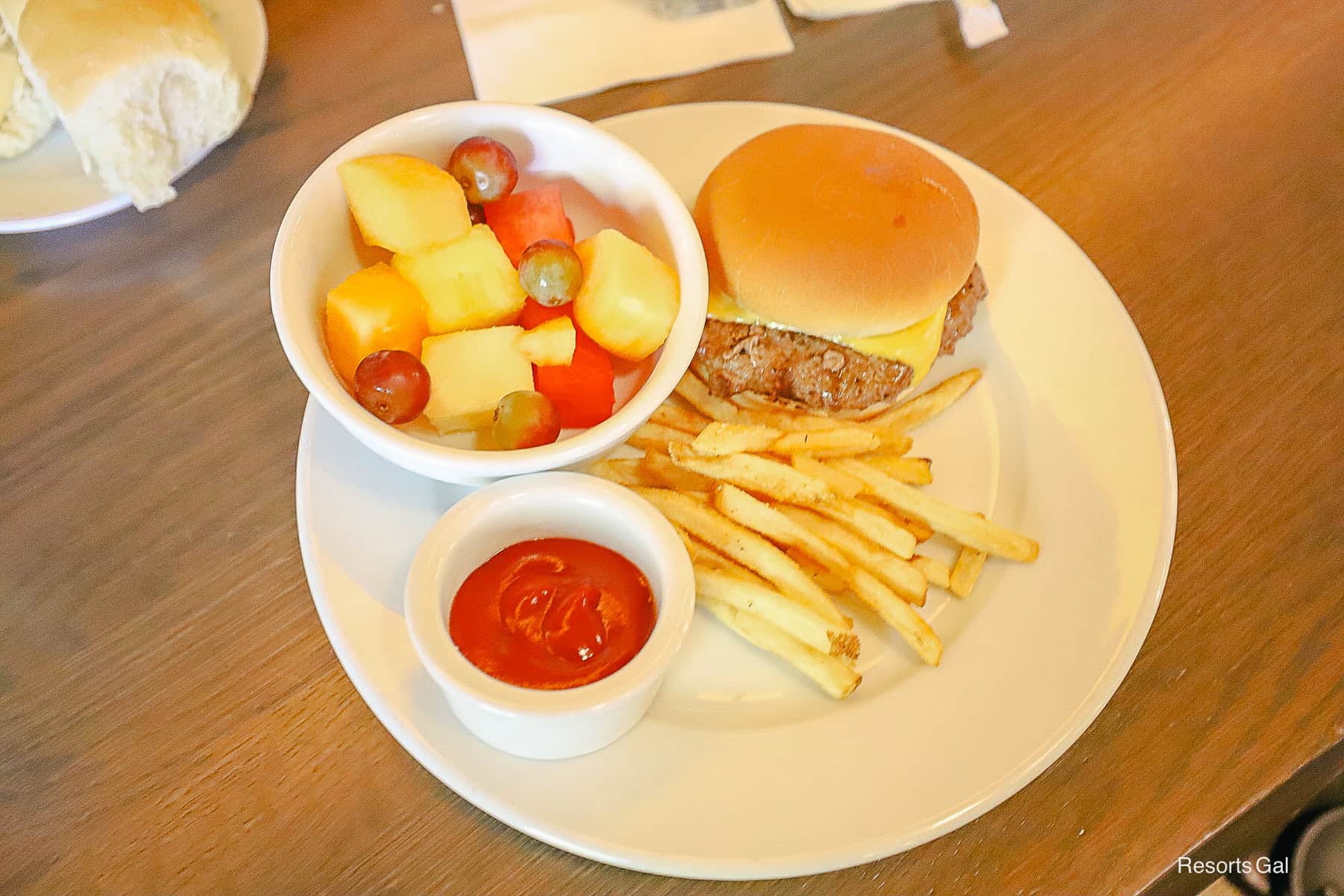 a cheeseburger with fries and fruit kids meal from Kona Cafe