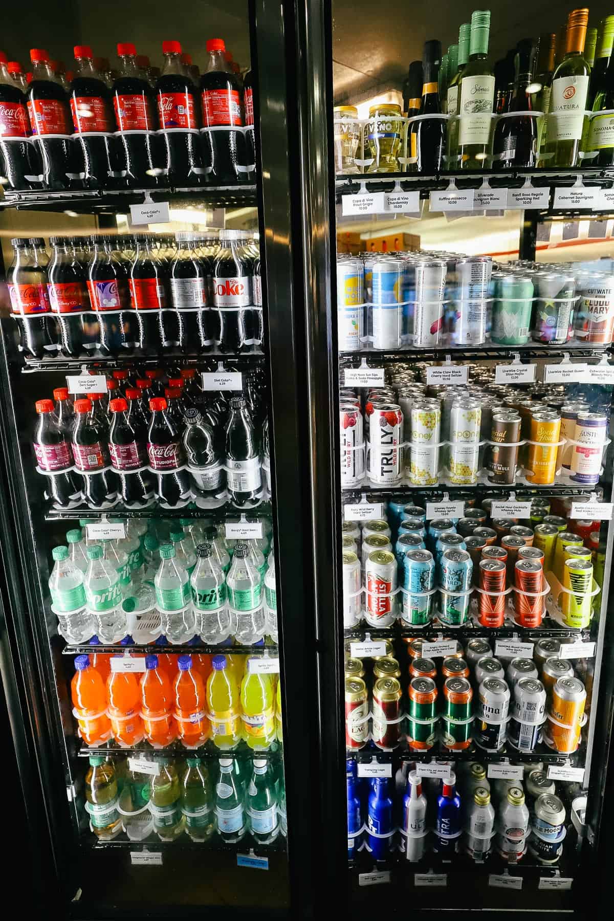 a case of various Coca Cola products, seltzer, beer, and wine 