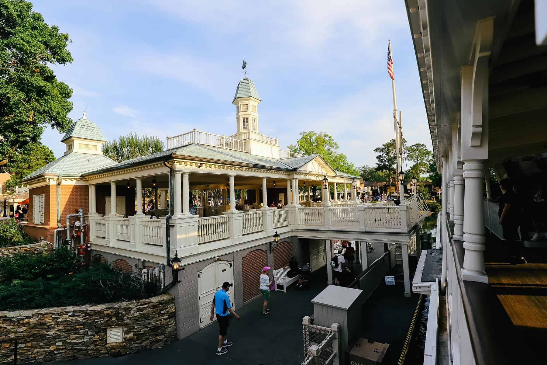 Shows guests getting ready to exit the boat on the lower level, while guests on the second level wait to board. 