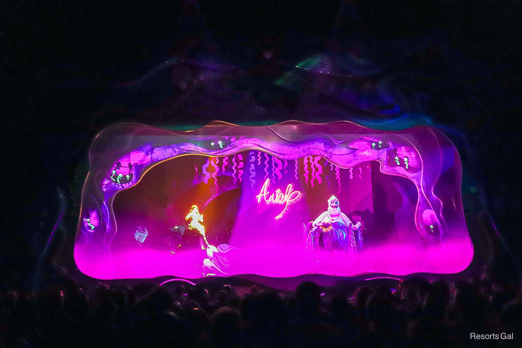 a scene featuring Ursula and Ariel where Ariel's signature appears in the air as she signs an agreement