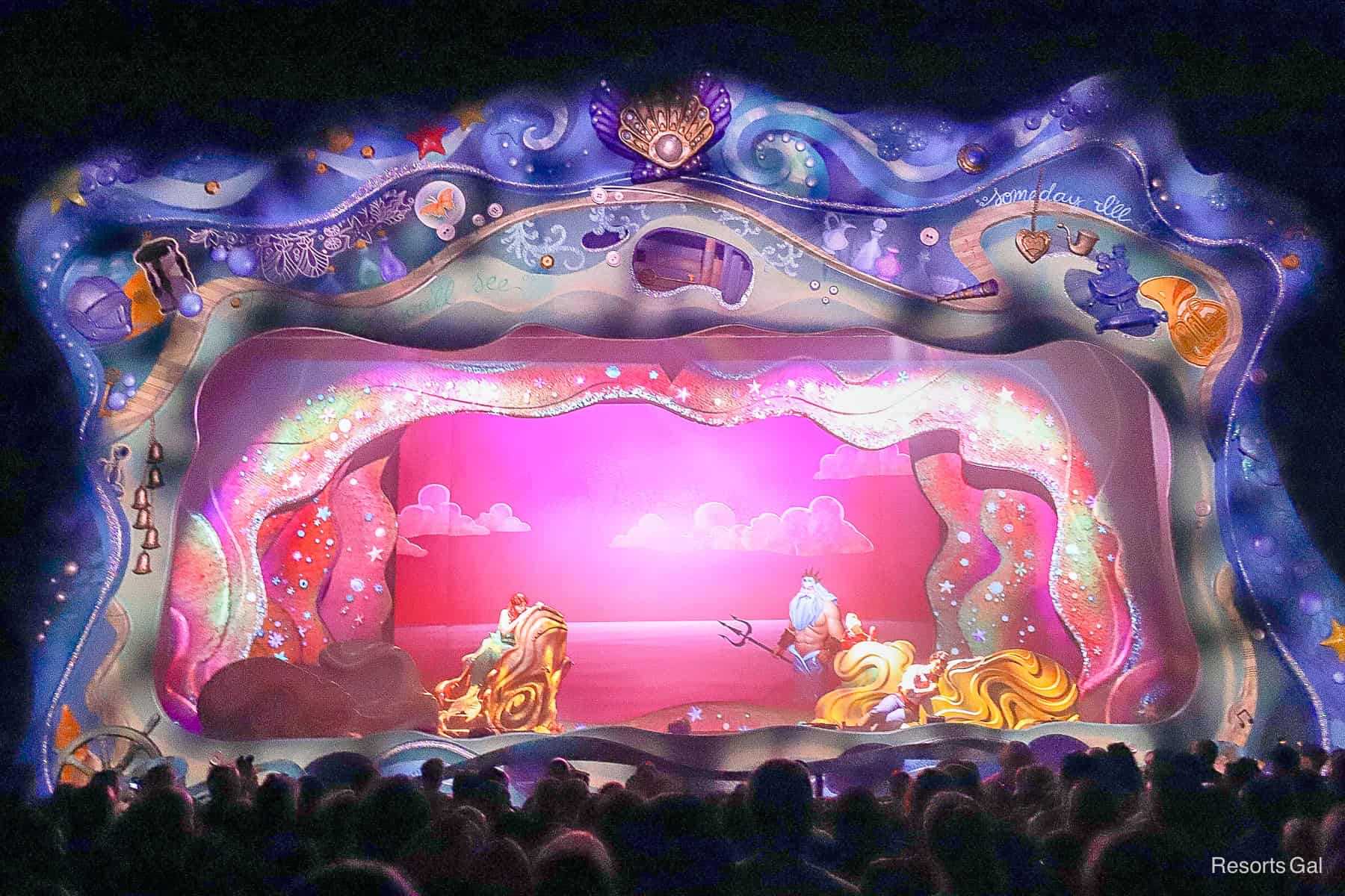 King Triton with Sebastian look on to Ariel and Eric