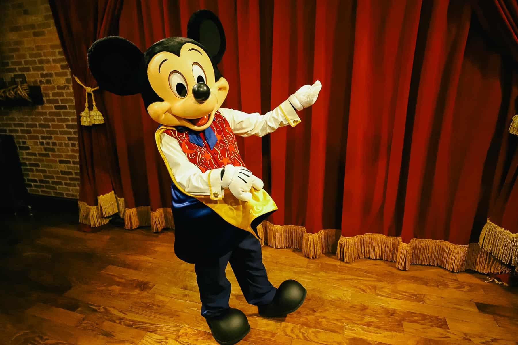 Mickey Mouse posing for a photo 