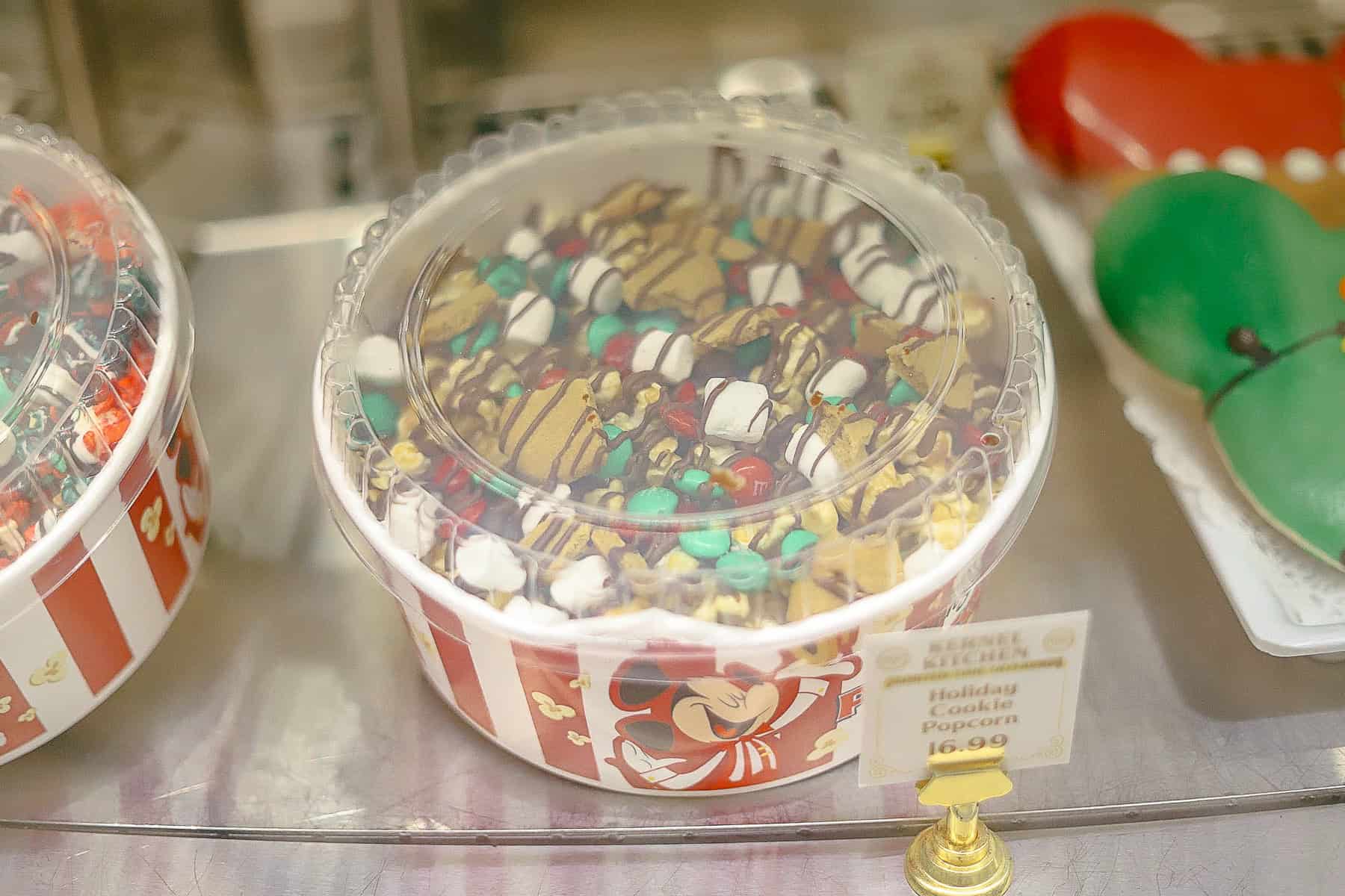 a bucket of the holiday cookie popcorn at Magic Kingdom 