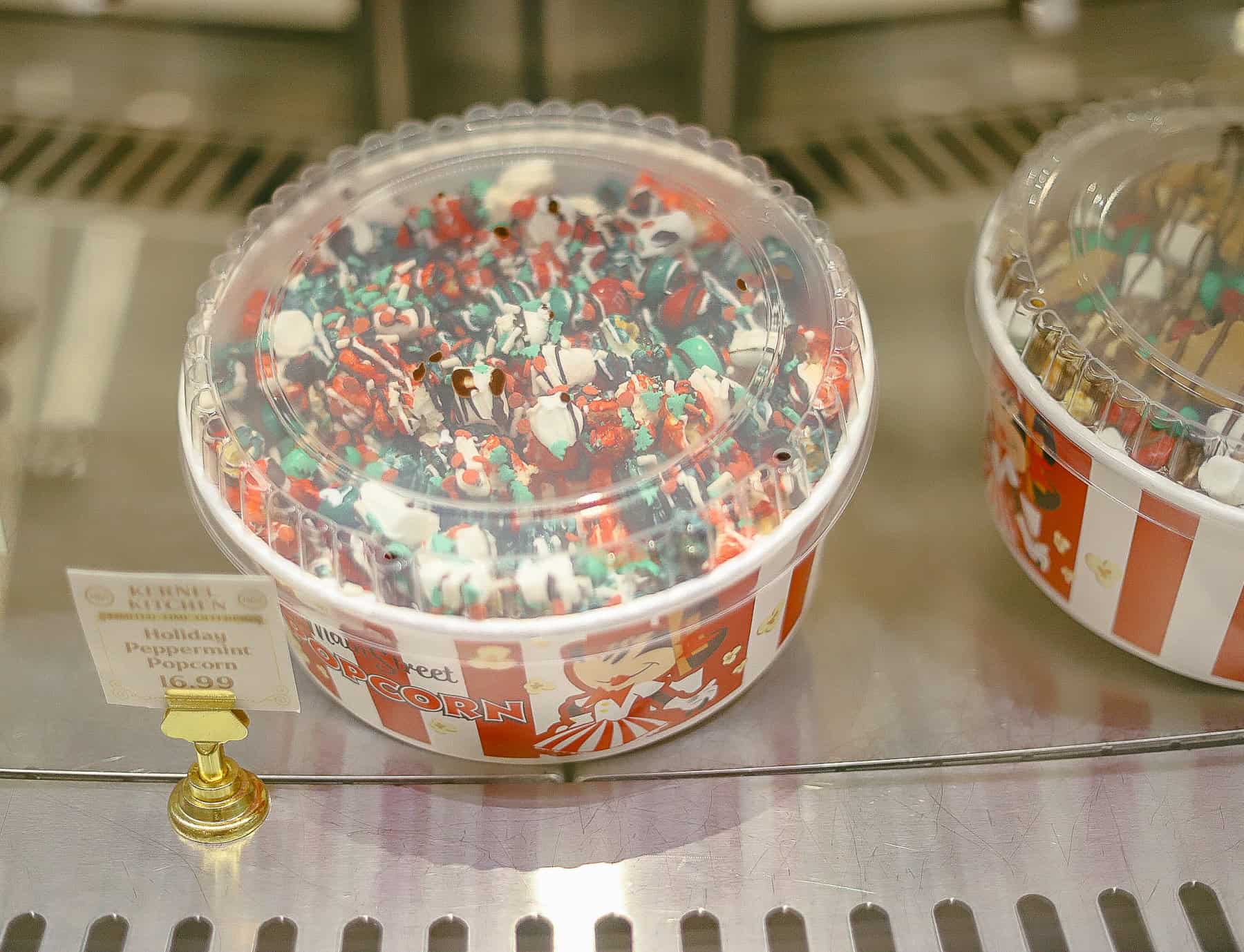 a bucket of the holiday peppermint popcorn at Christmas Main Street Confectionery 