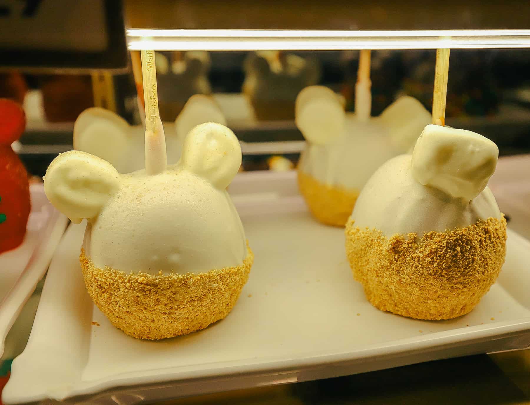 a plain white chocolate dipped Candy apple dipped in dust 