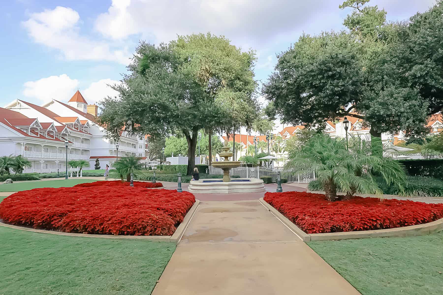 Landscape with red flowers planted at Grand Floridian. 