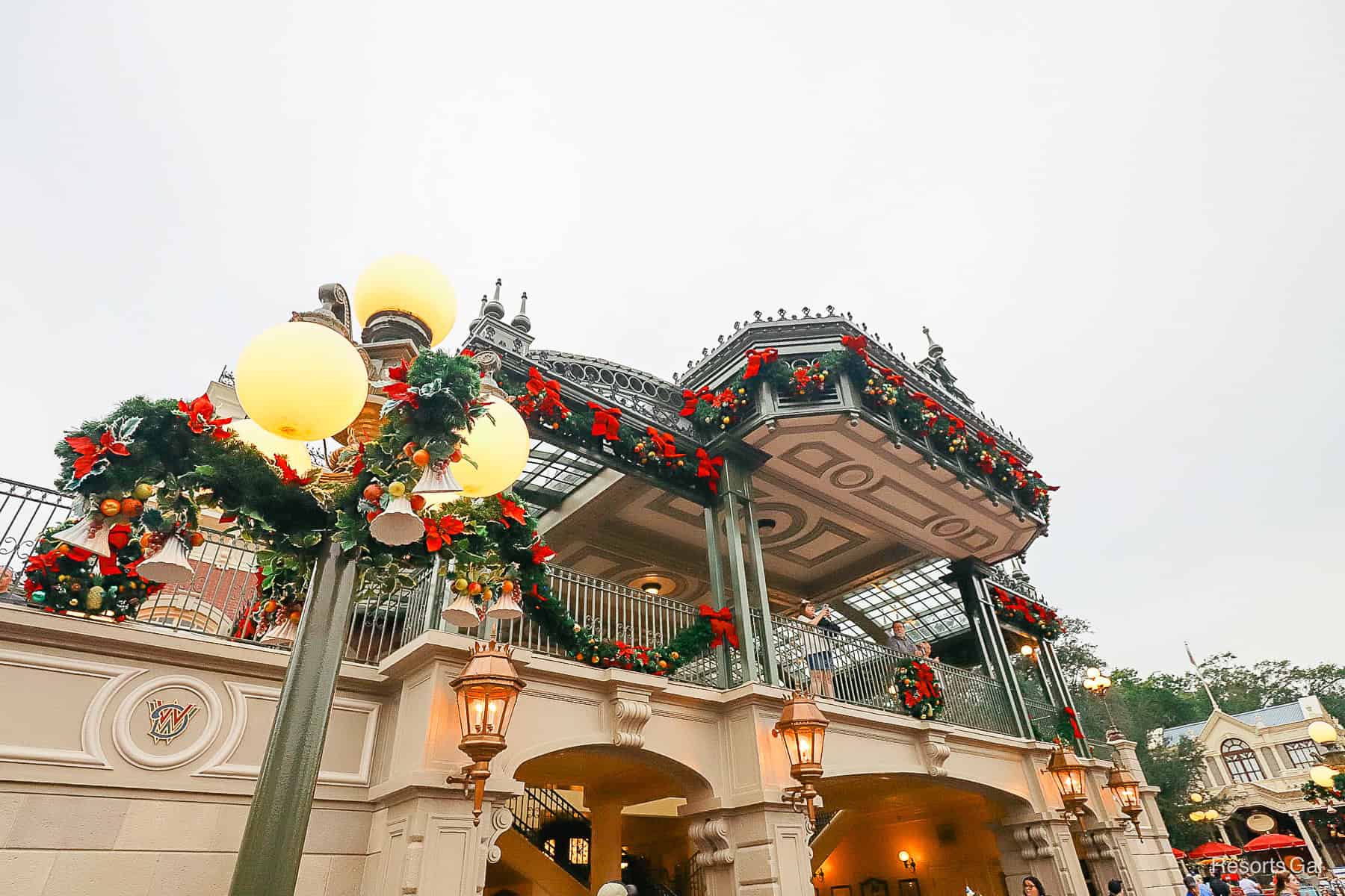 the garland wrapped around the Main Street U.S.A. train station at Magic Kingdom 