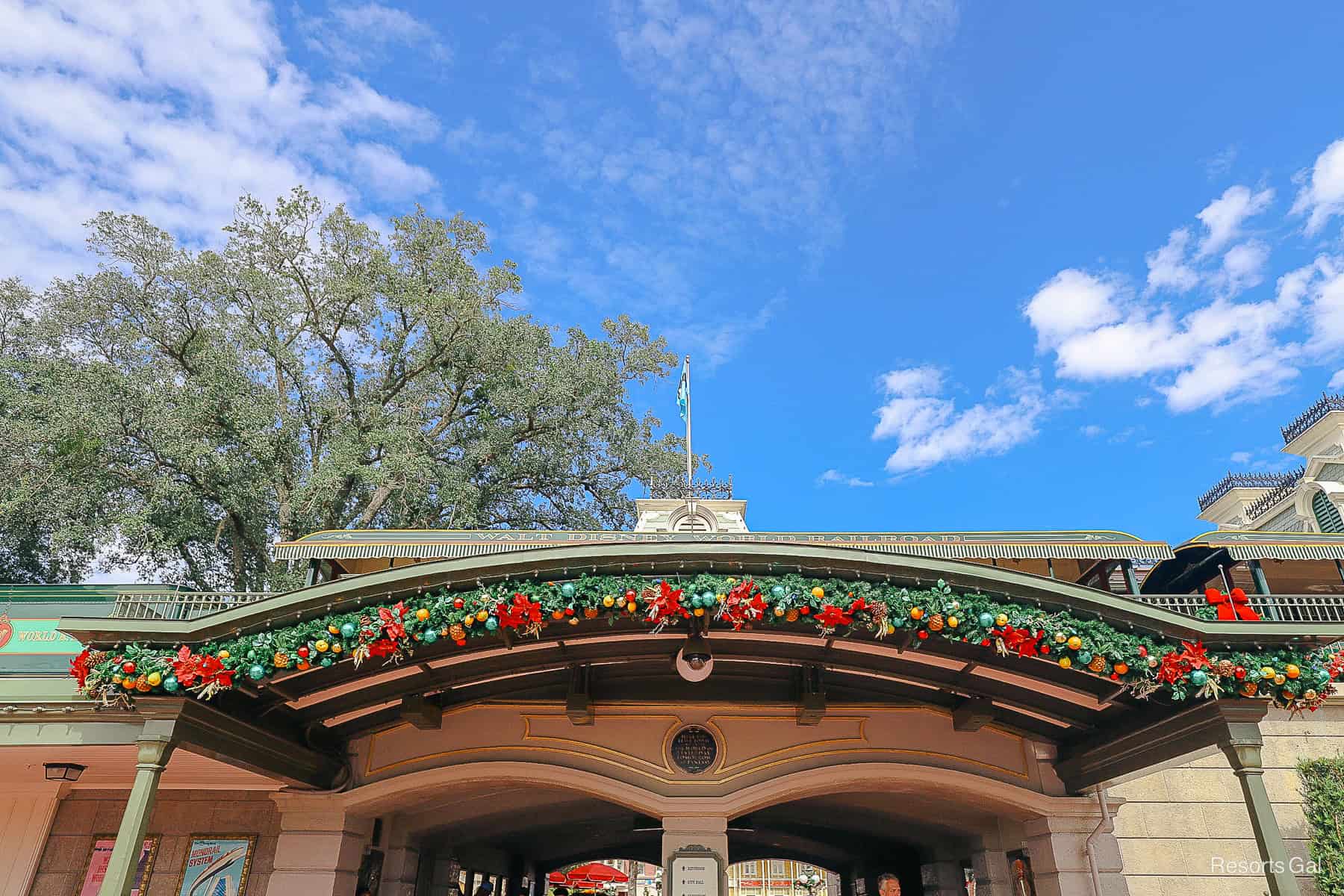 garland over the train station tunnel on Main Street U.S.A. 