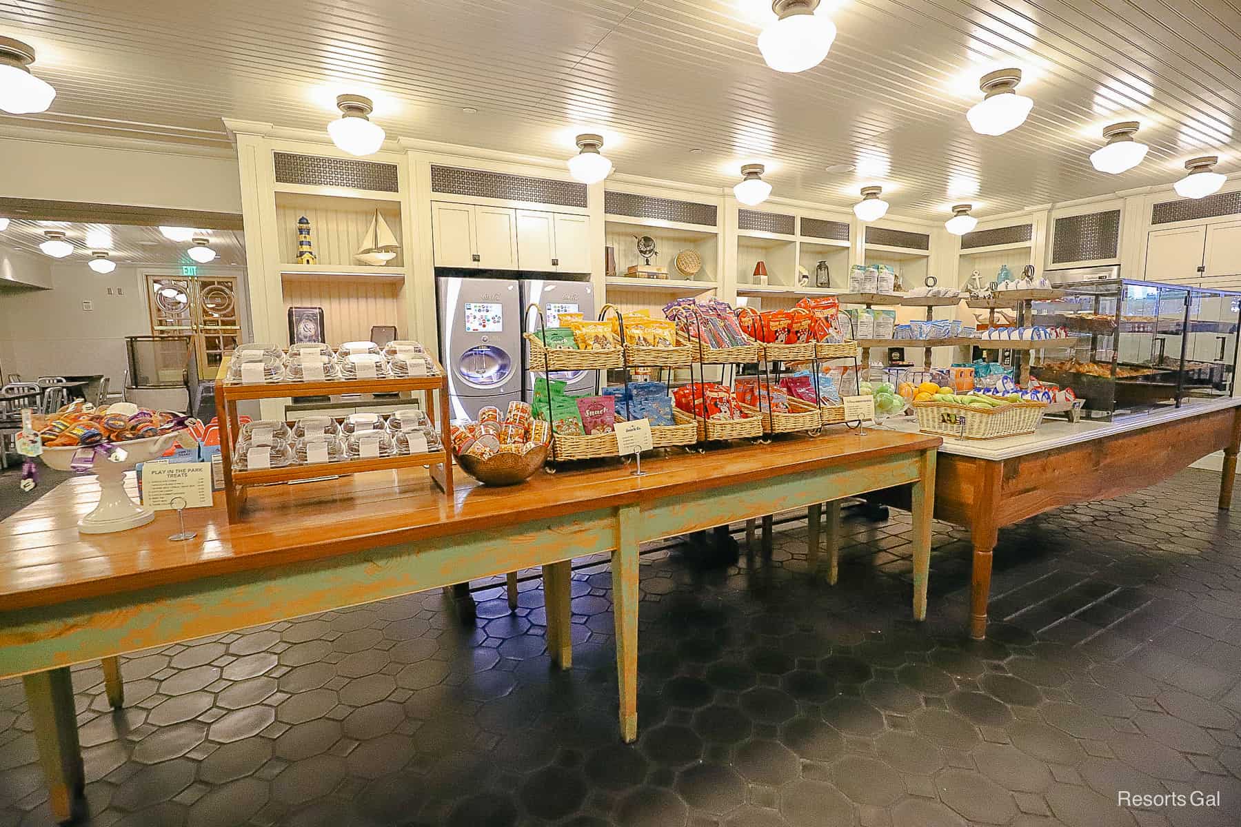 a long table with various snack offering at Ale and Compass Market 