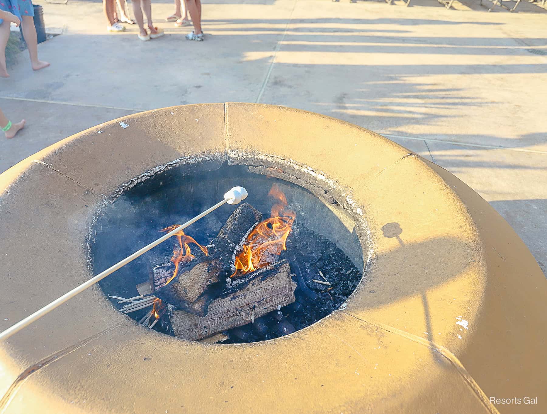 roasting a marshmallow on the fire pit at Coronado Springs