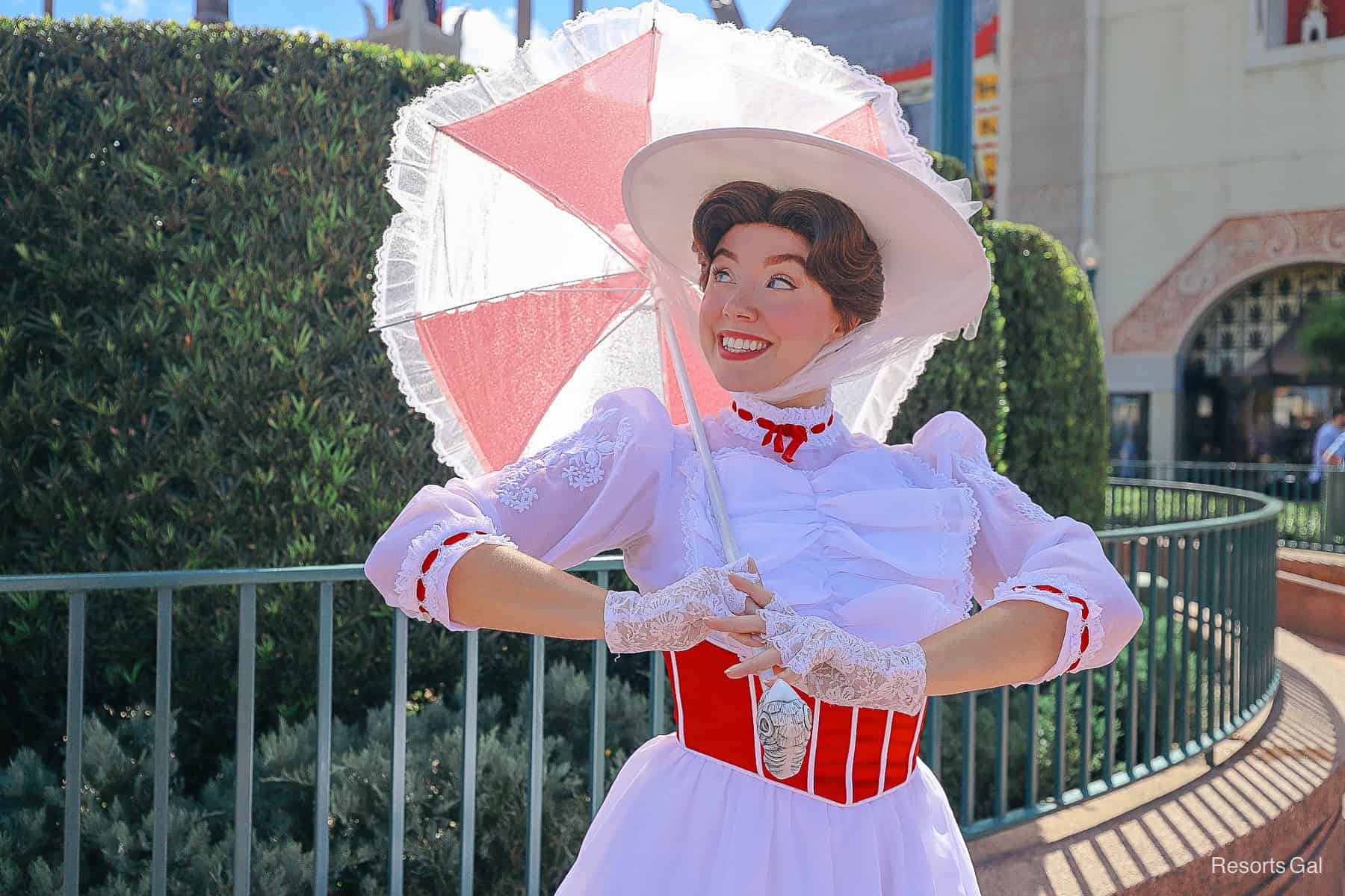Mary Poppins smiles for a pose 