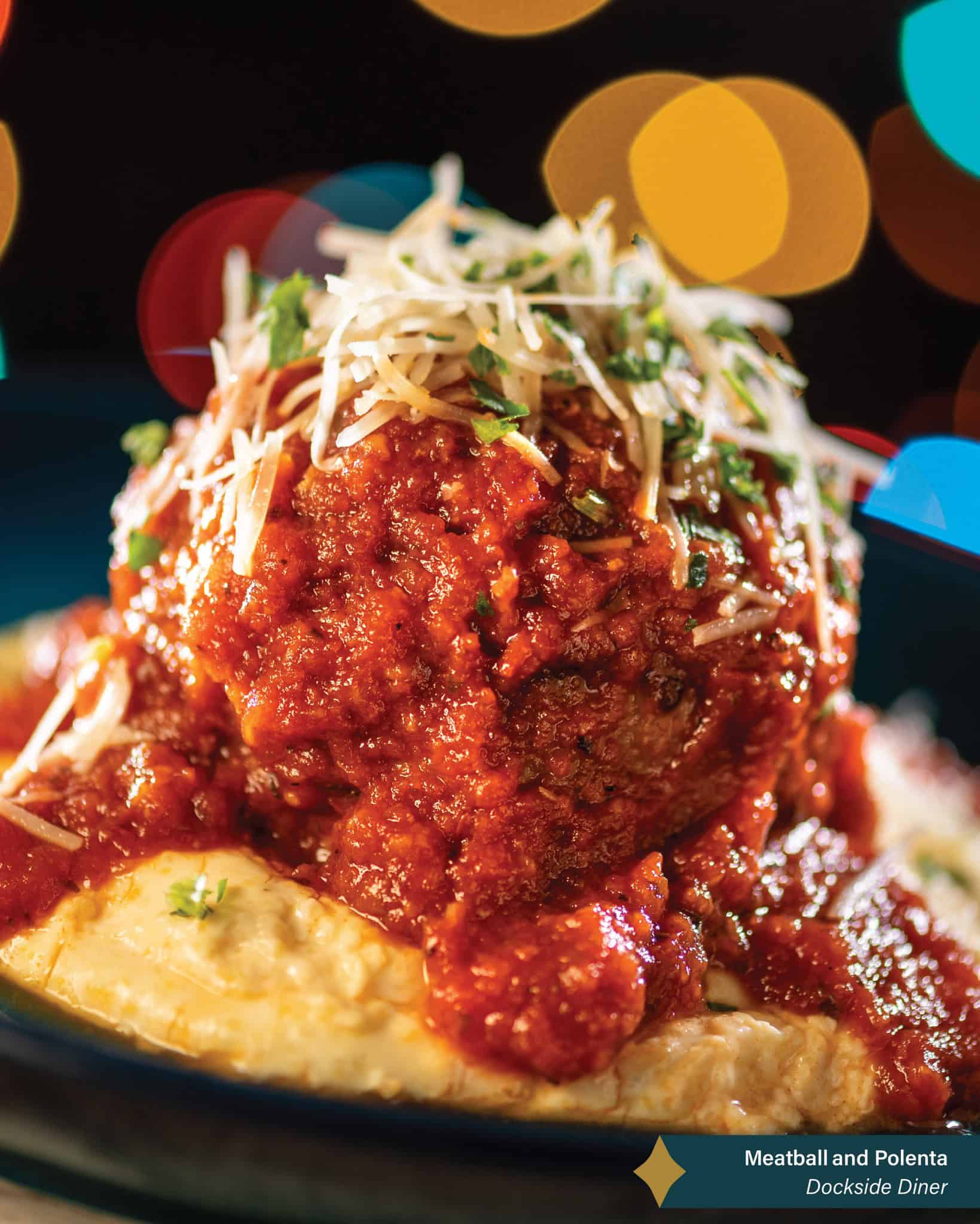 a meatball in sauce with Parmesan cheese