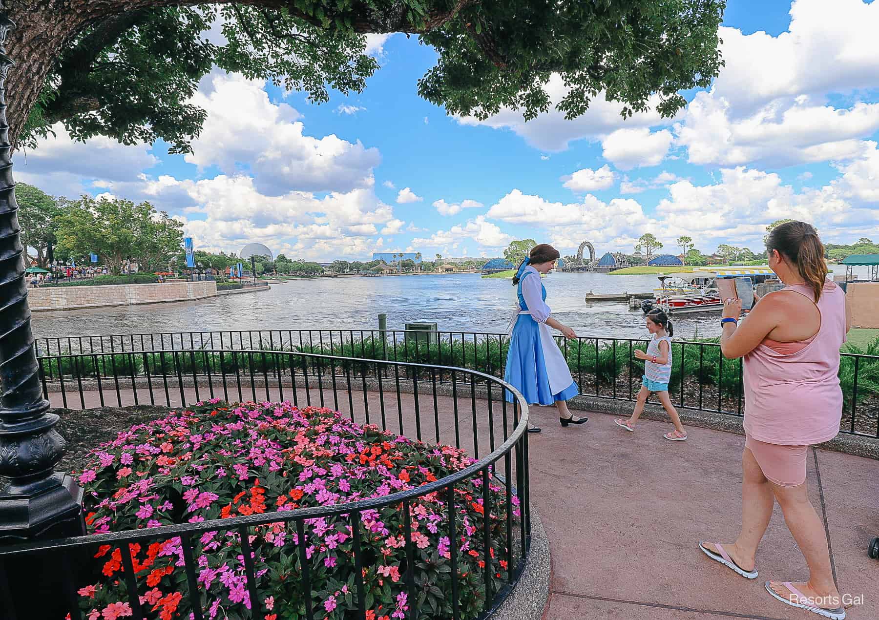 Guests walking up to meet guests at Epcot. 