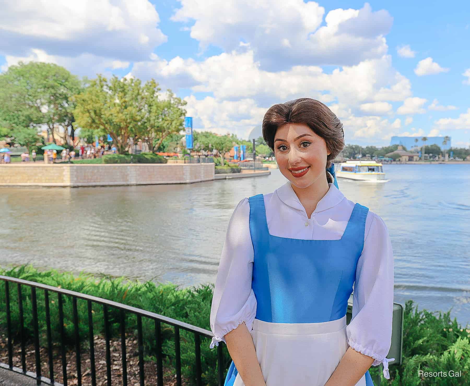 Belle poses in her village dress at Epcot. 