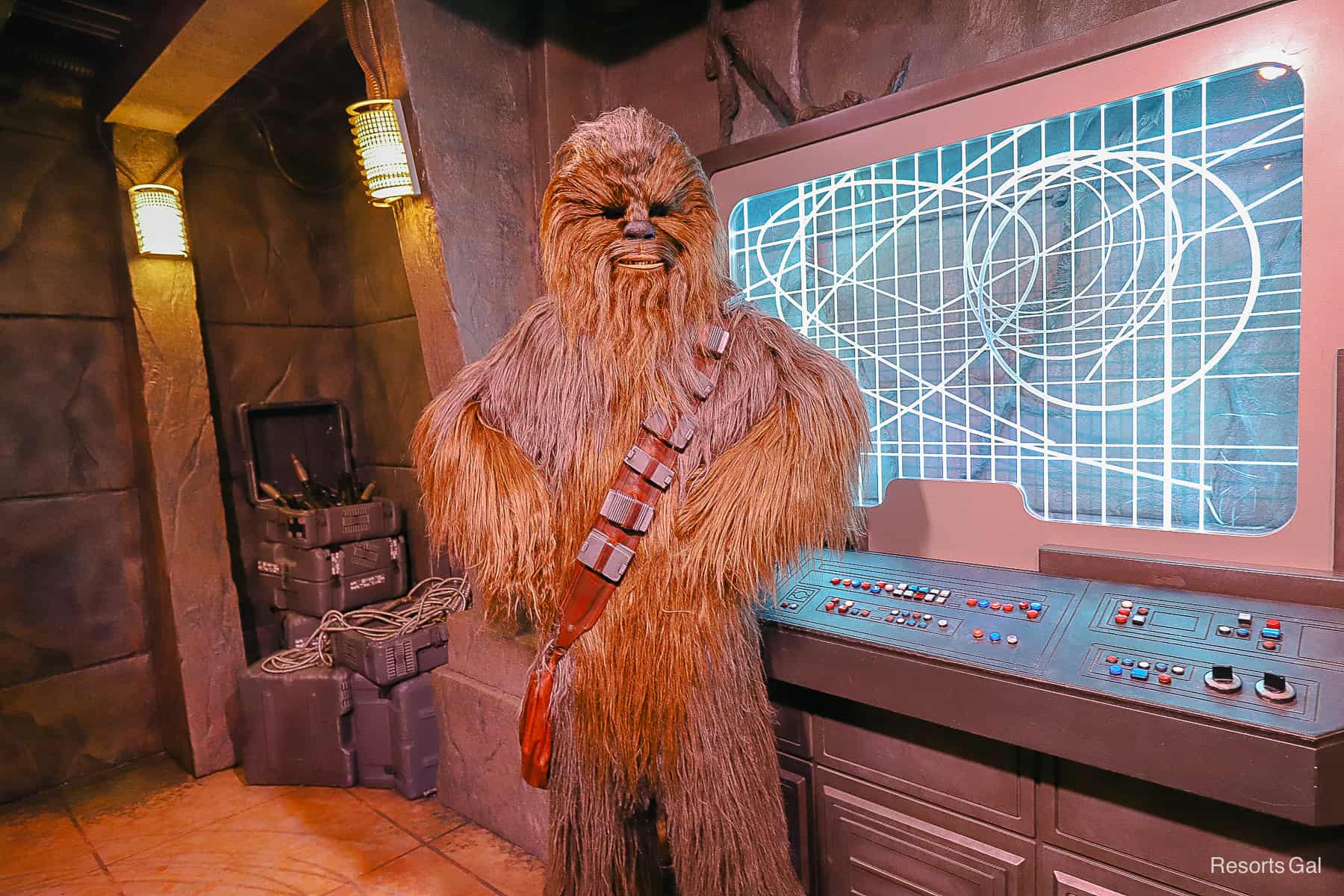 Chewbacca poses for a photo with hands on his hips. 