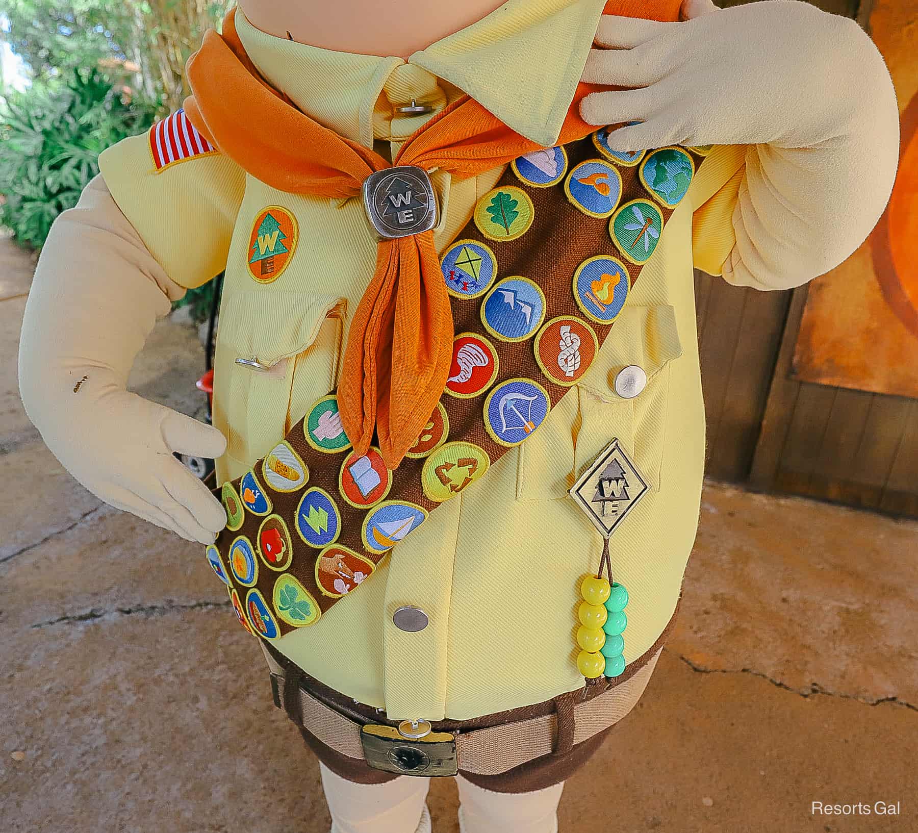 Russell shows off his decorative sash of Wilderness Explorer badges 