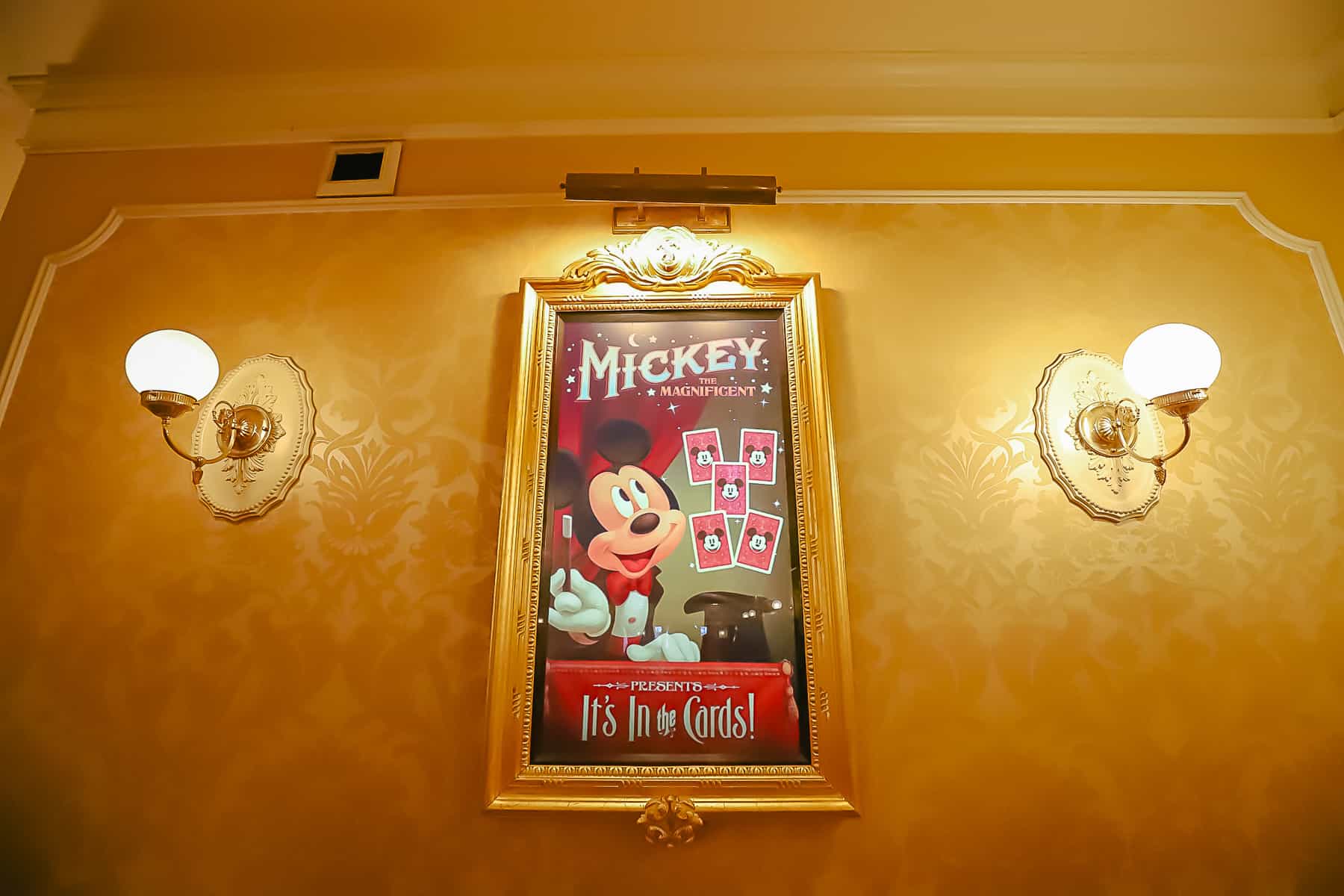 electronic sign that shows Mickey Mouse doing magic tricks with cards. 