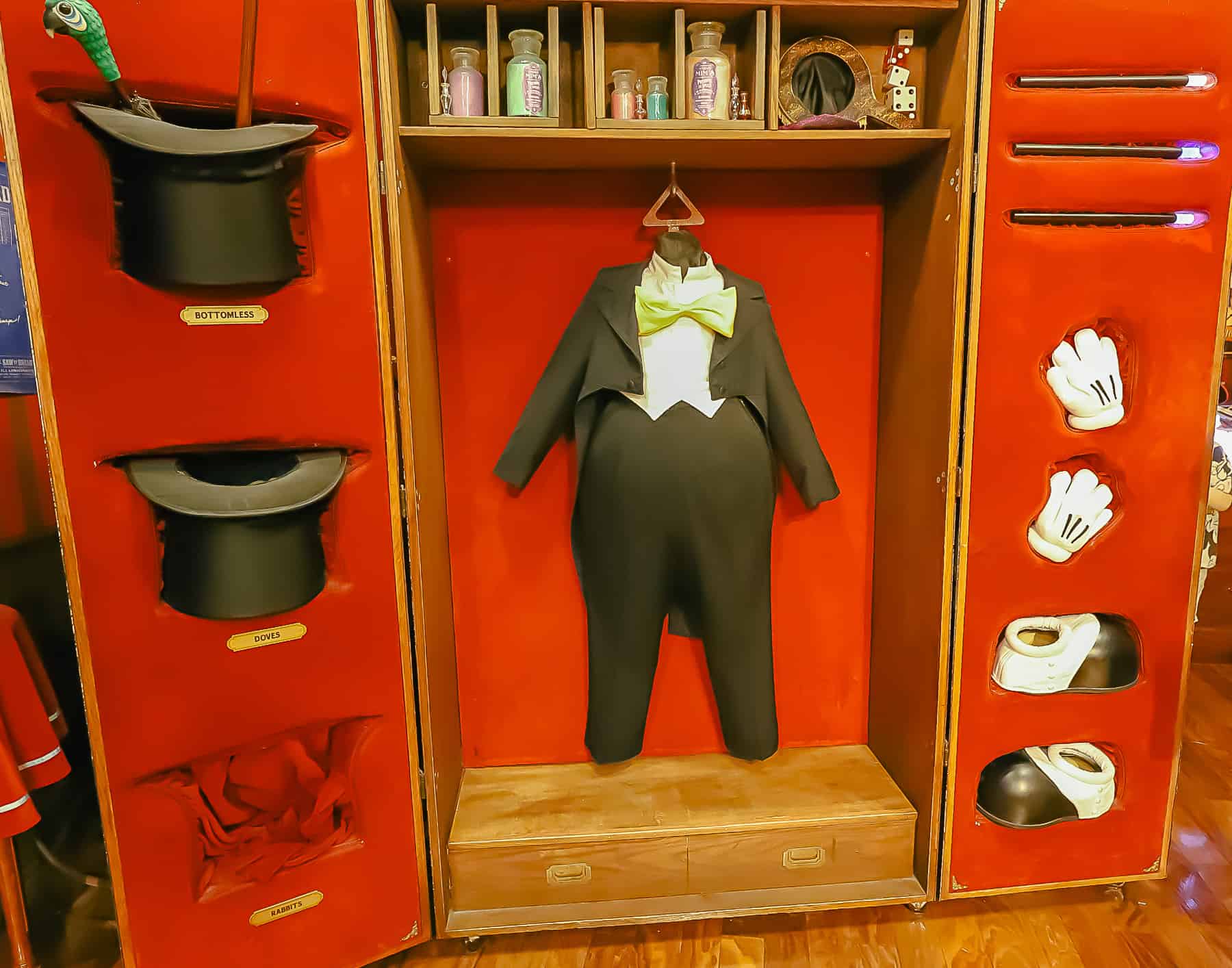 a display with Mickey's costume and his magic hats, gloves, and shoes
