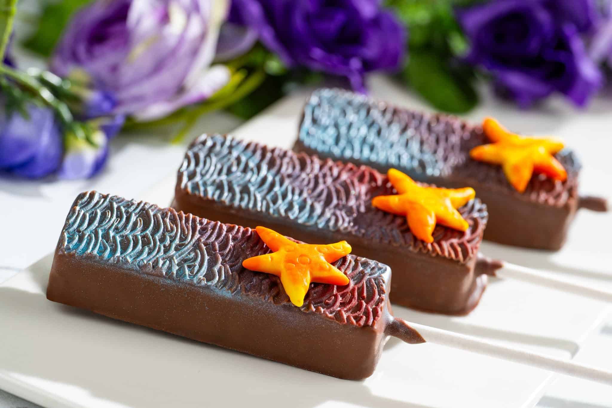 three Little Mermaid inspired ganache pops with star fish represent Ariel for World Princess Week in 2026