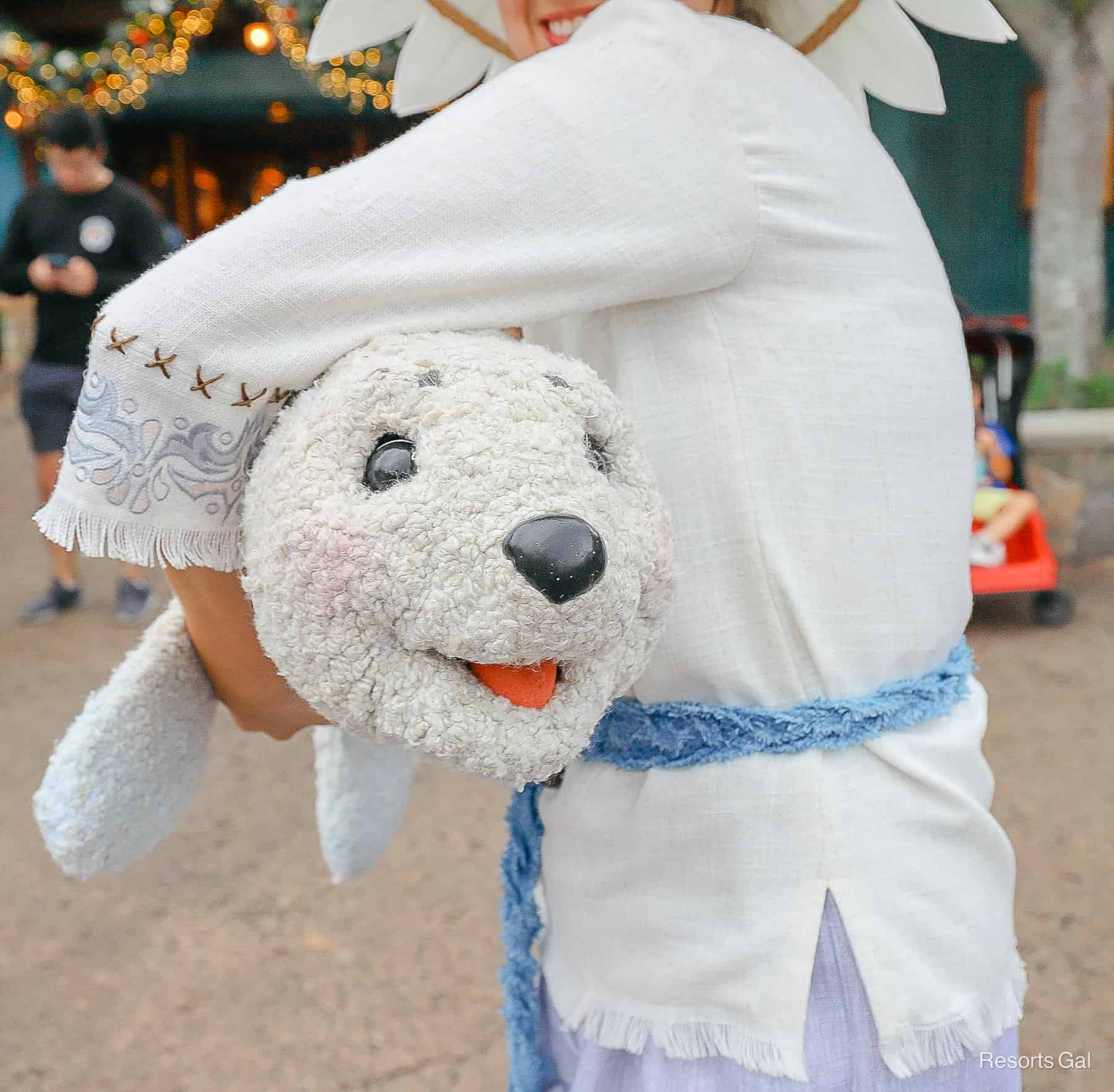 a seal with a puppeteer that's part of the Merry Menagerie during the holiday season at Disney's Animal Kingdom