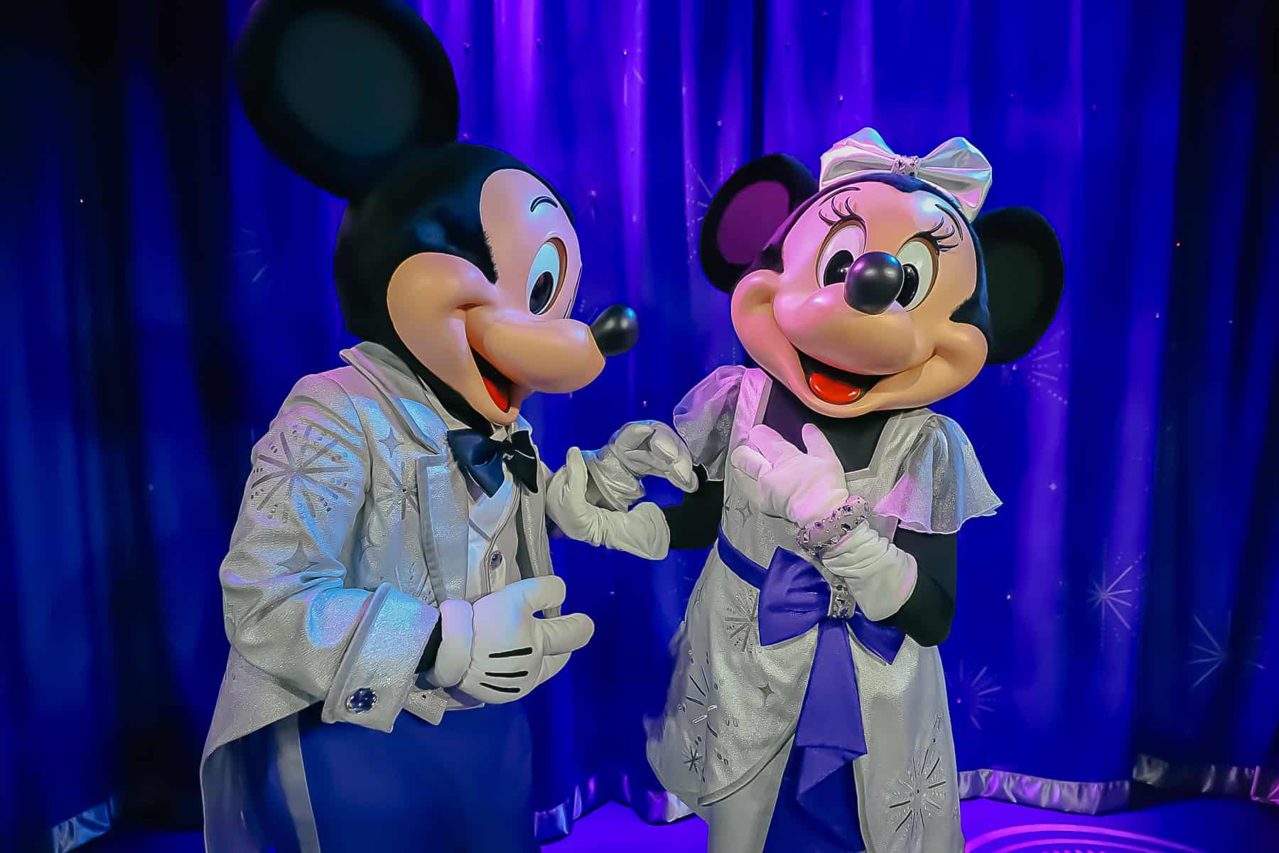 Mickey looking lovingly at Minnie Mouse. 