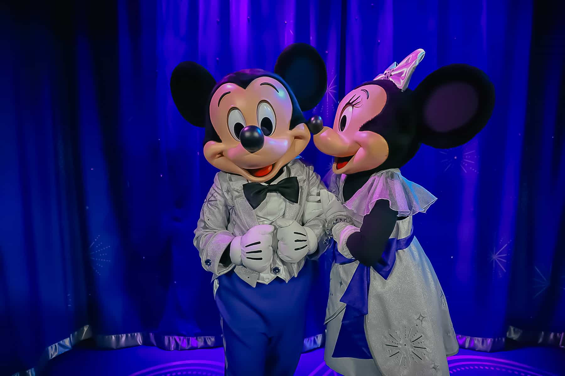 Minnie looking lovingly at Mickey. 