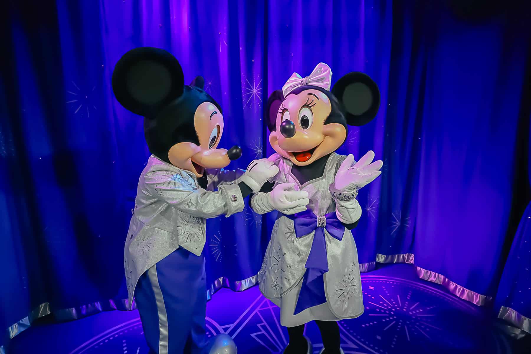 Mickey and Minnie getting ready to pose for a photo. 