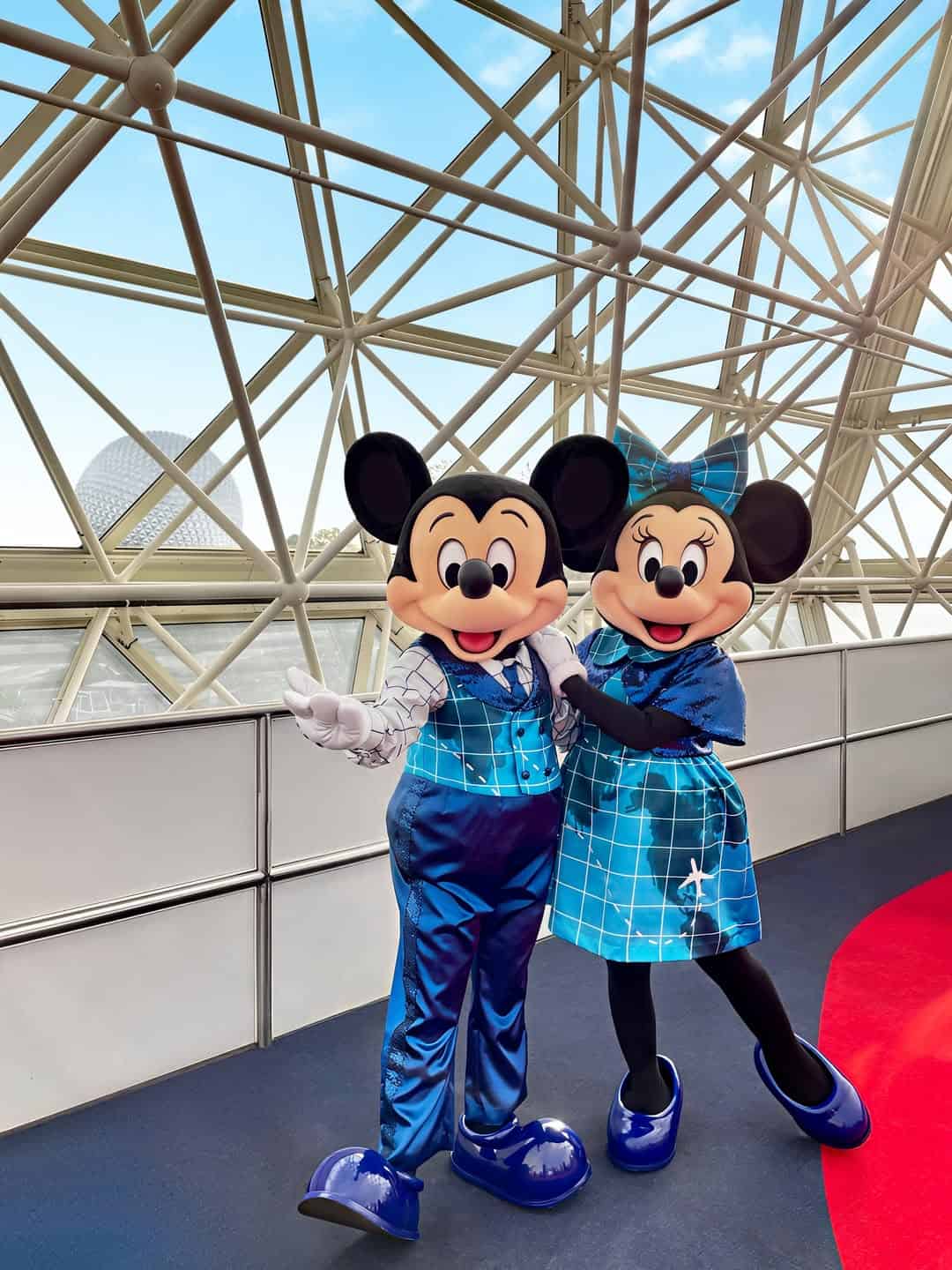 Mickey and Minnie Mouse wearing blue shades travel inspired outfits