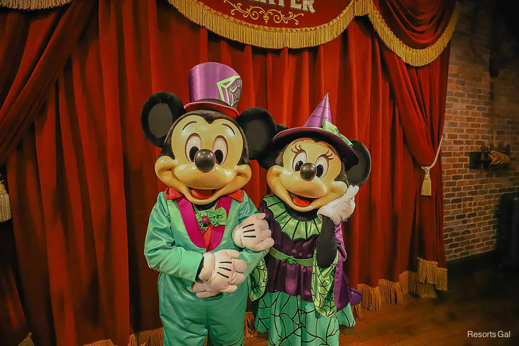 Mickey and Minnie Mouse pose with arms intertwined 