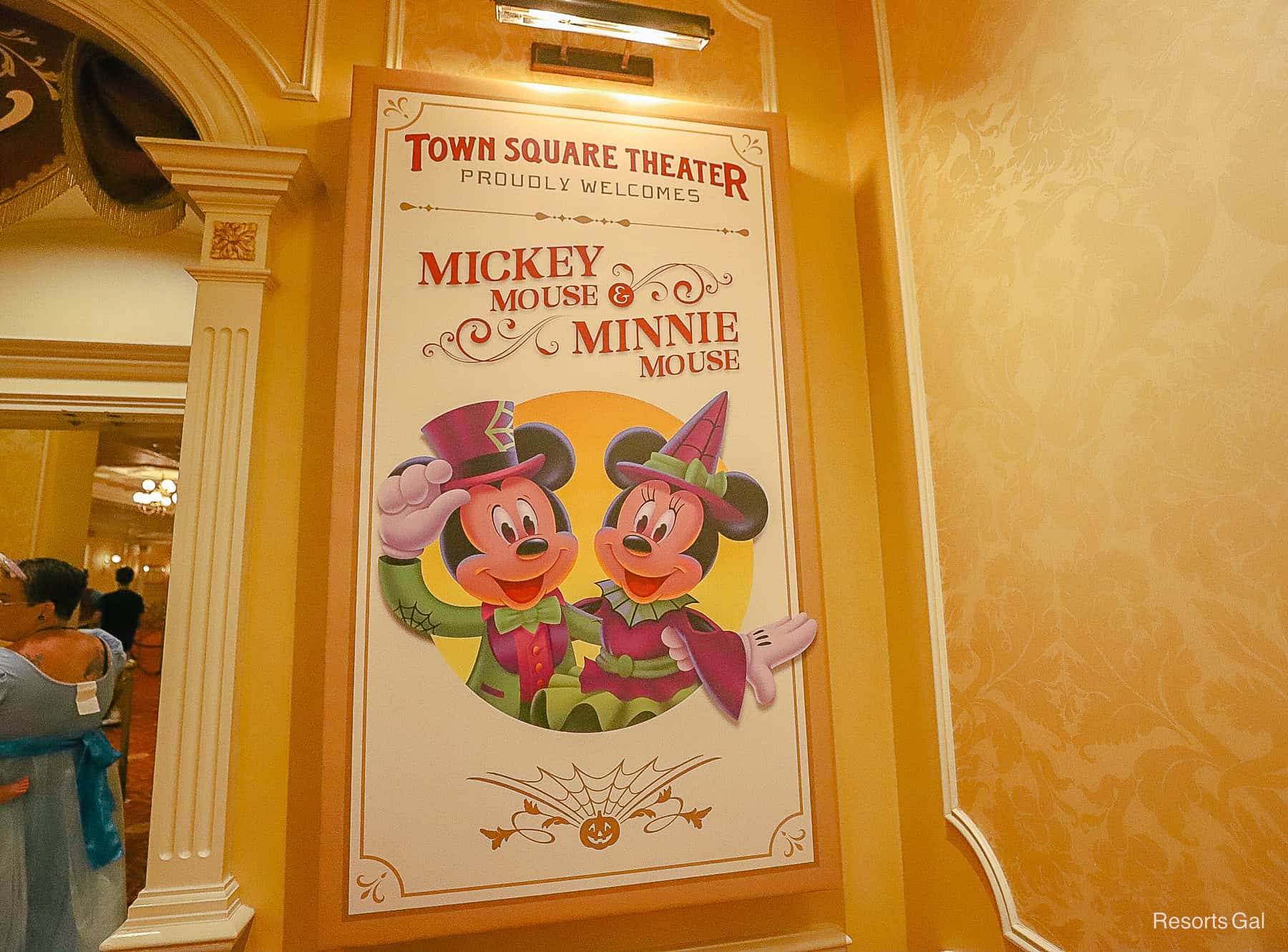 signage that read Mickey Mouse and Minnie Mouse with their Halloween Costume 
