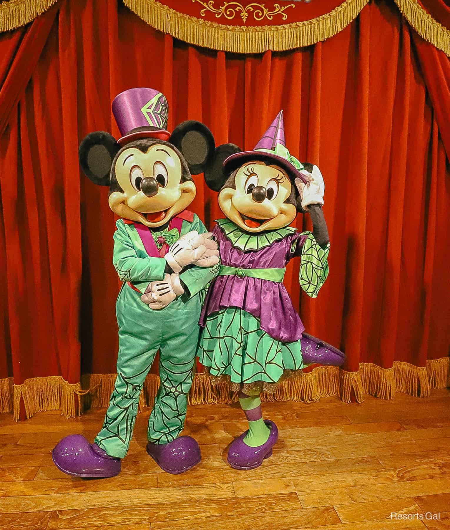 Mickey and Minnie Mouse with Minnie tipping hat to camera 