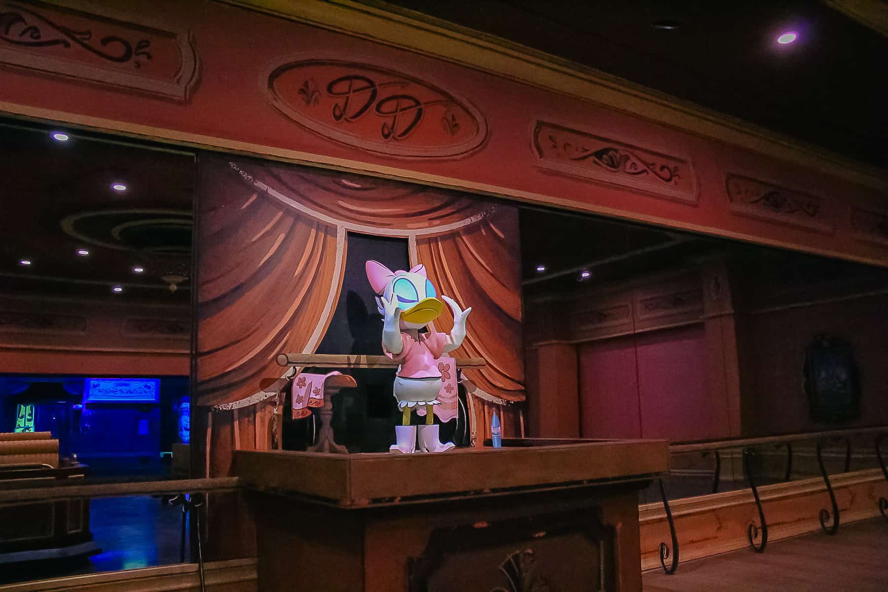 Scene where Daisy Duck is conducting a dance recital. 