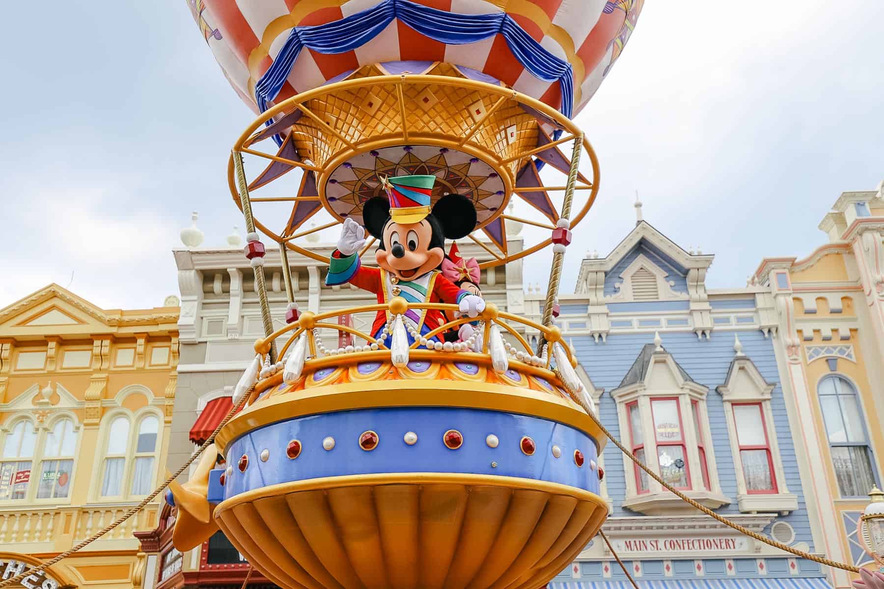 Mickey waves to guests from his float. 