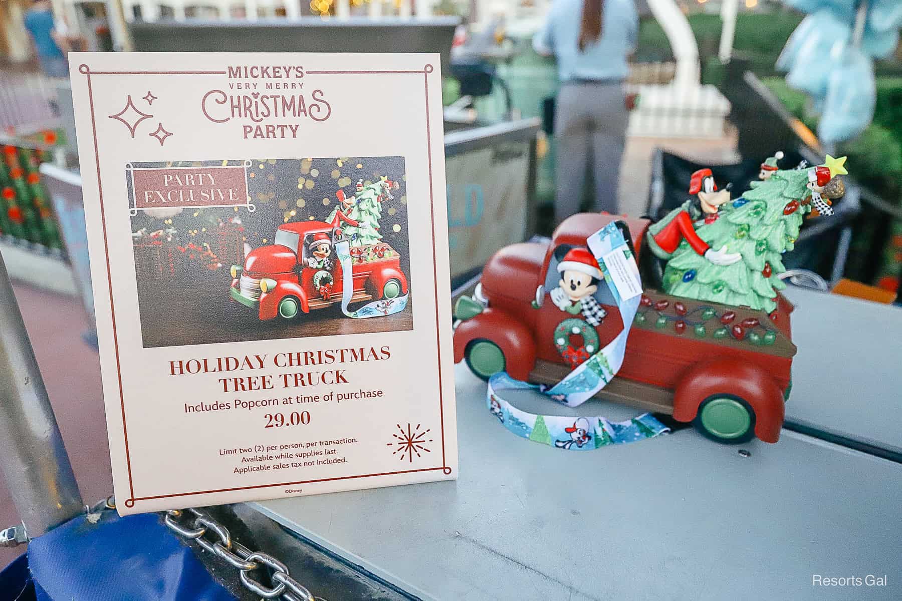 a sign that tells how the popcorn bucket is a party exclusive item and costs $29.00. It includes popcorn at the time of purchase. 