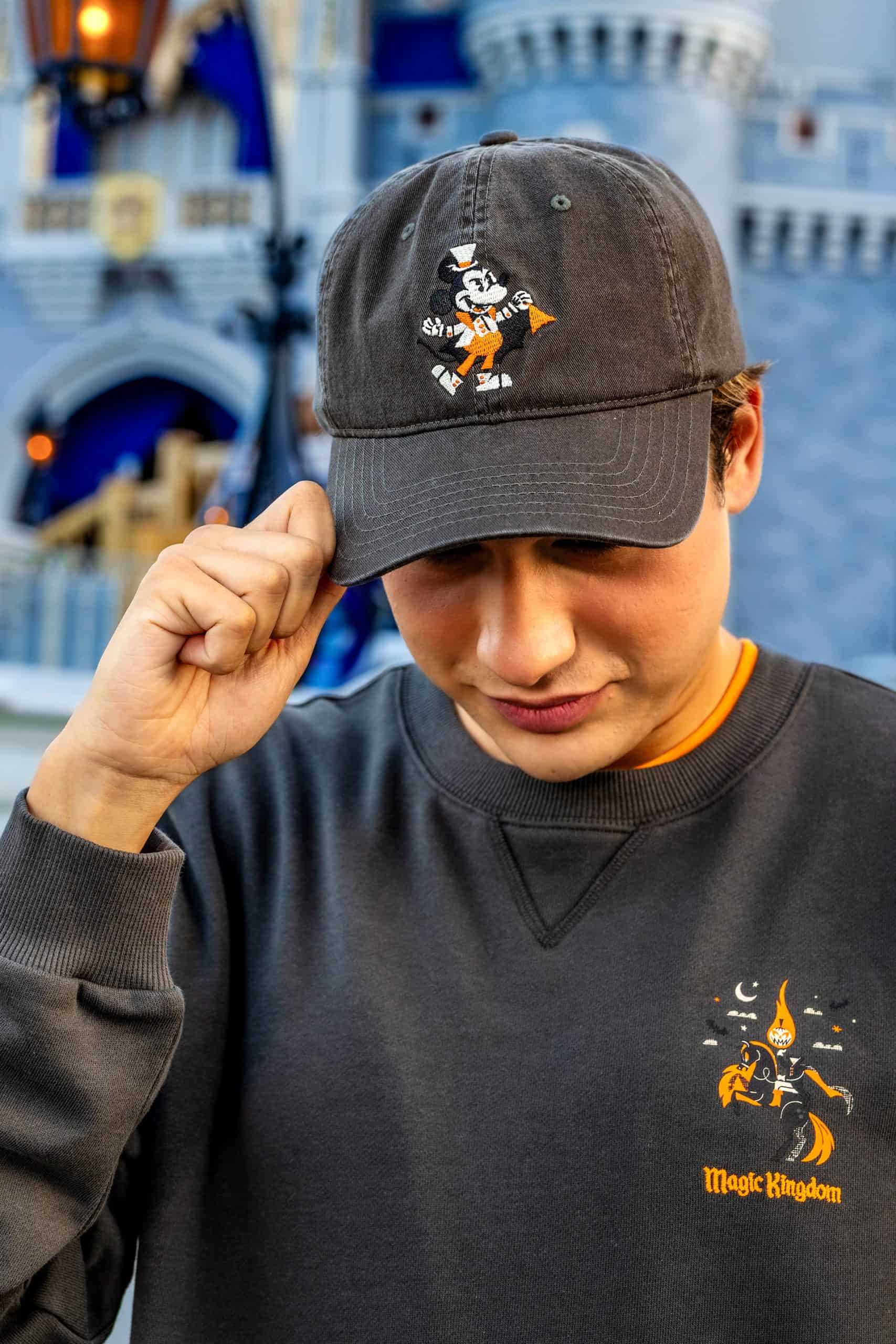 a black ball cap with Mickey Mouse