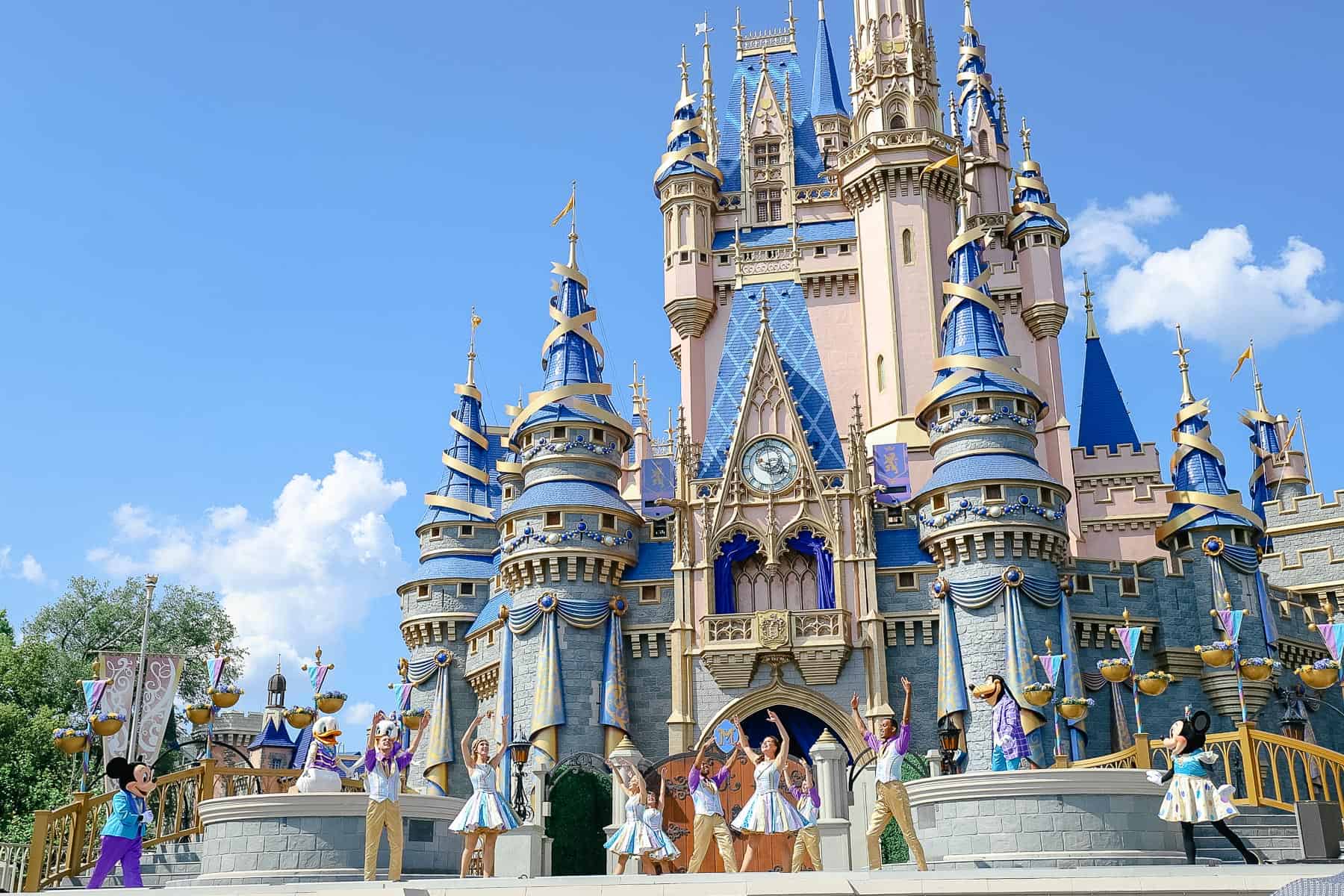 A cast of performers on the stage for the beginning of Mickey's Magical Friendship Faire. 