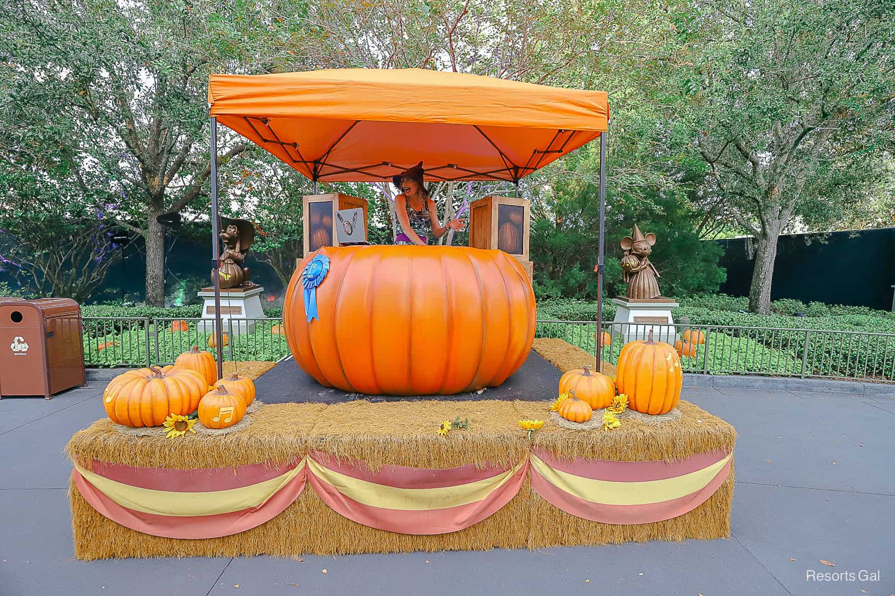a DJ spinning tunes on a giant pumpkin at the Halloween Party entrance 