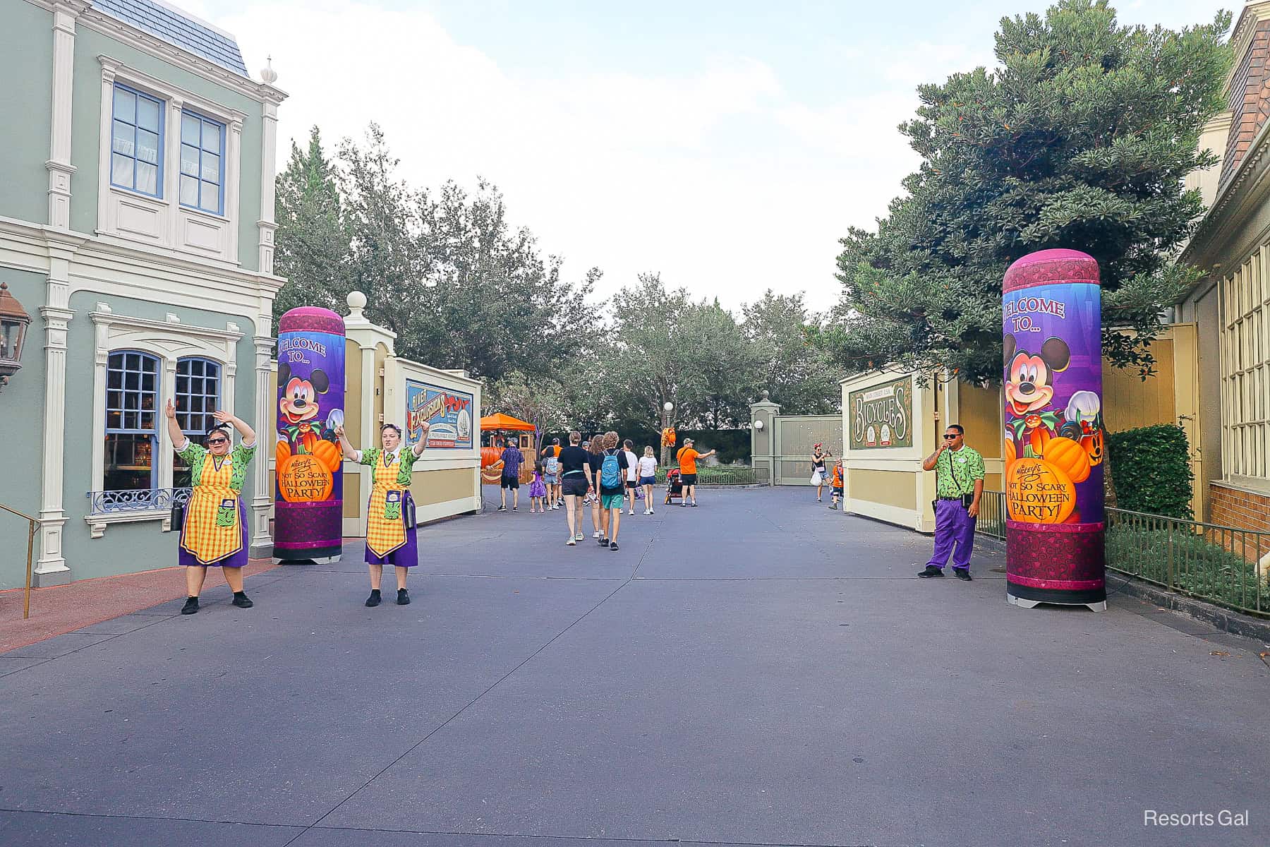 cast members ushering guests into the Market Street Welcome at Mickey's Not So Scary Halloween Party 