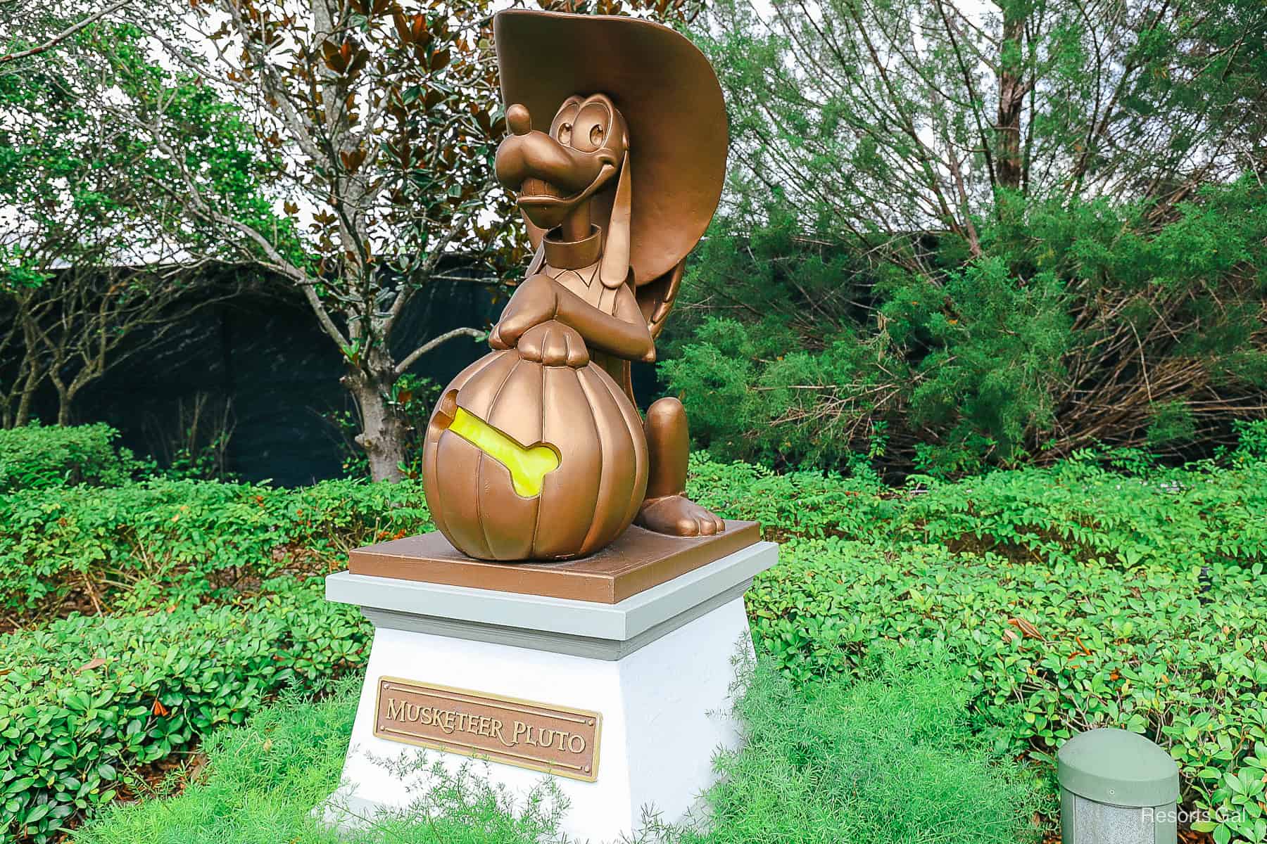 a statue of Pluto in a Halloween costume in a trick-or-treat-location during the party