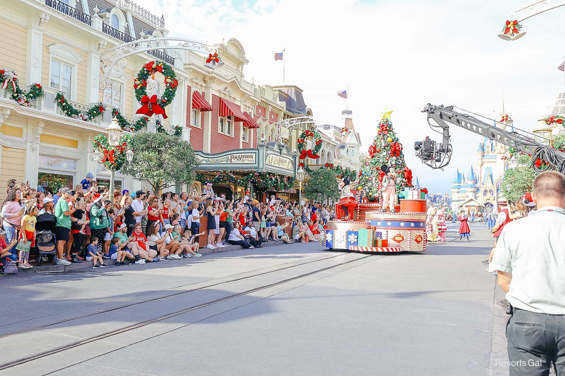 a film crew taping Mickey's Once Upon a Christmastime Parade at Magic Kingdom 
