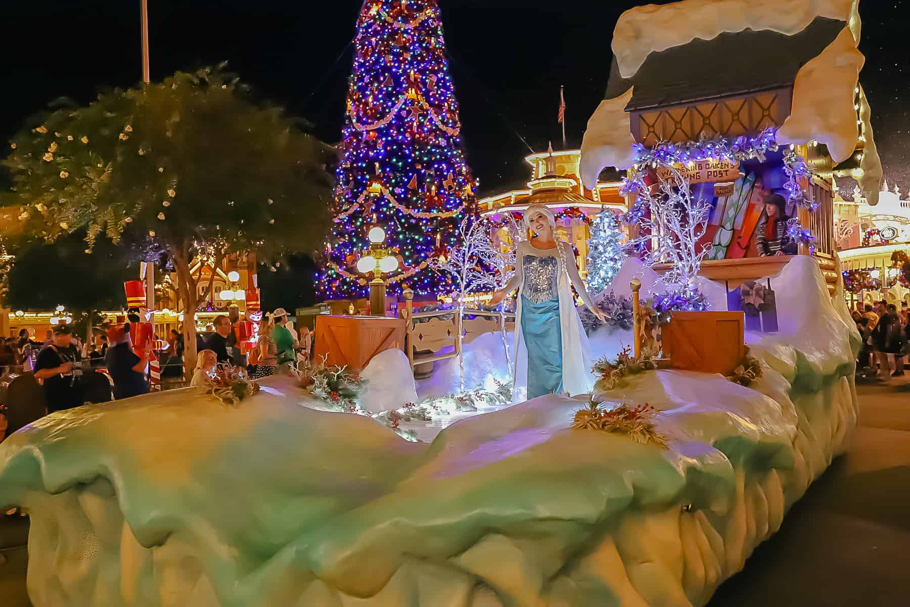 Elsa poses on the parade float. This is the nighttime version. 