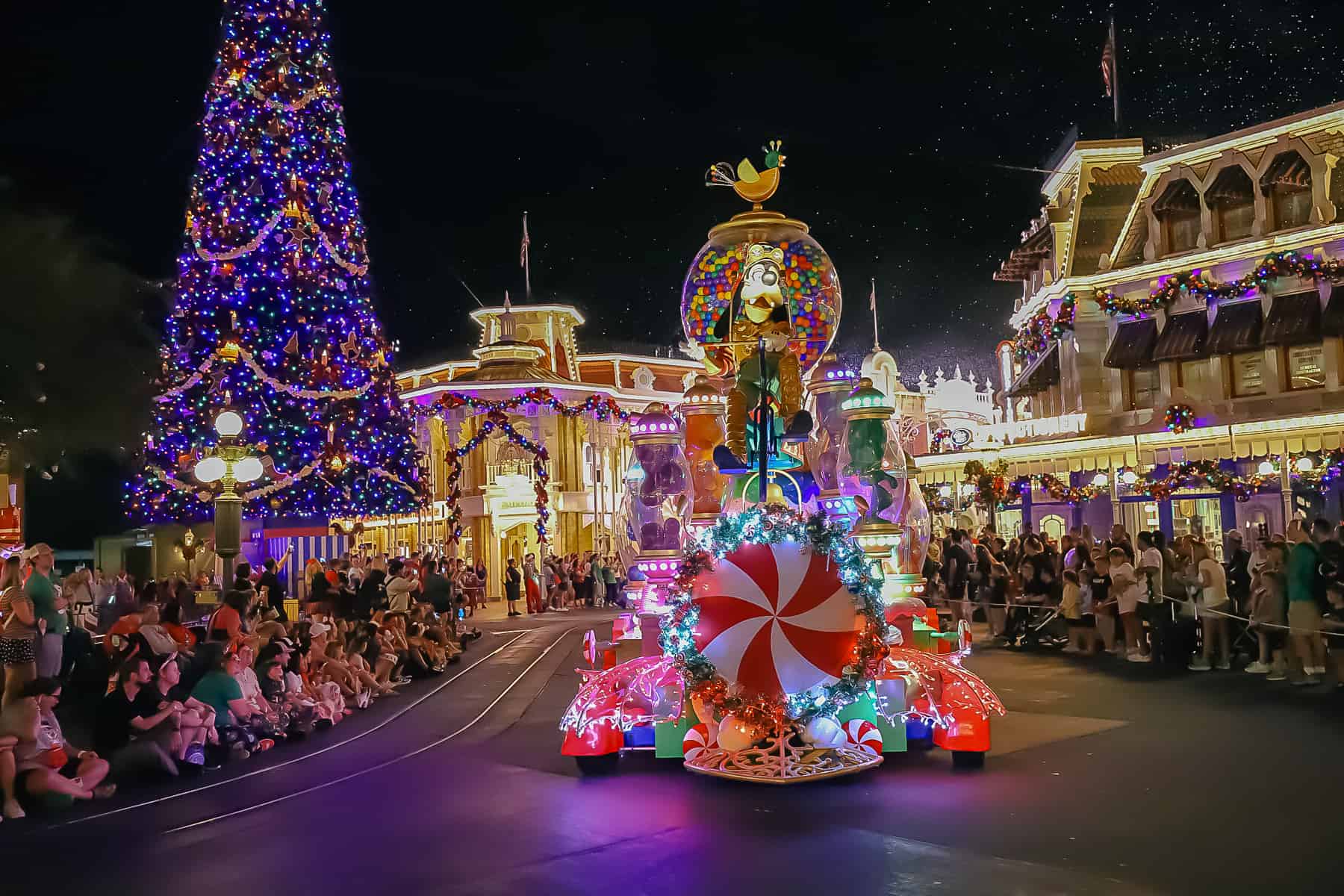 Goofy on a huge parade float that pumps a candy scent into the air. 