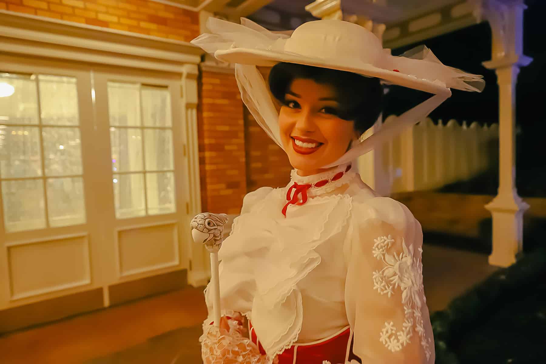 Mary Poppins meeting with guests on the patio at the Christmas Party. 