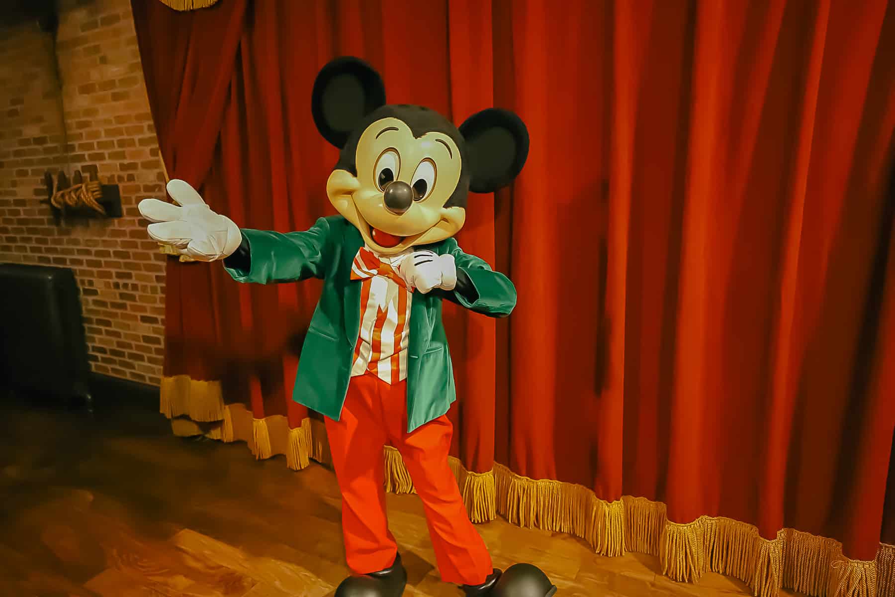 Mickey at Town Square Theater is in Christmas Party attire. 